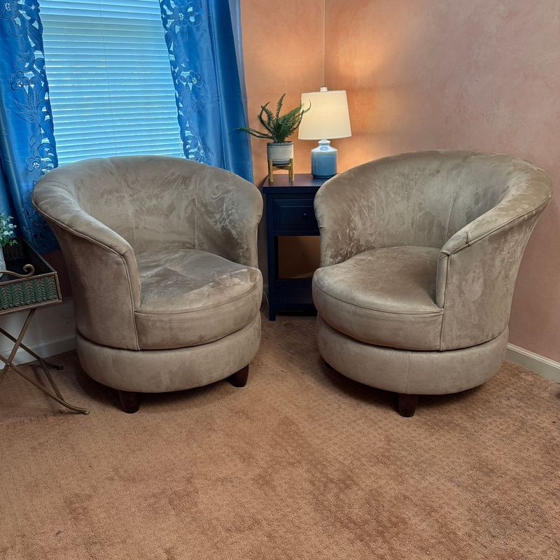 Pair of microsuede tan swivel club chairs, mild wear 33"H x 32"W