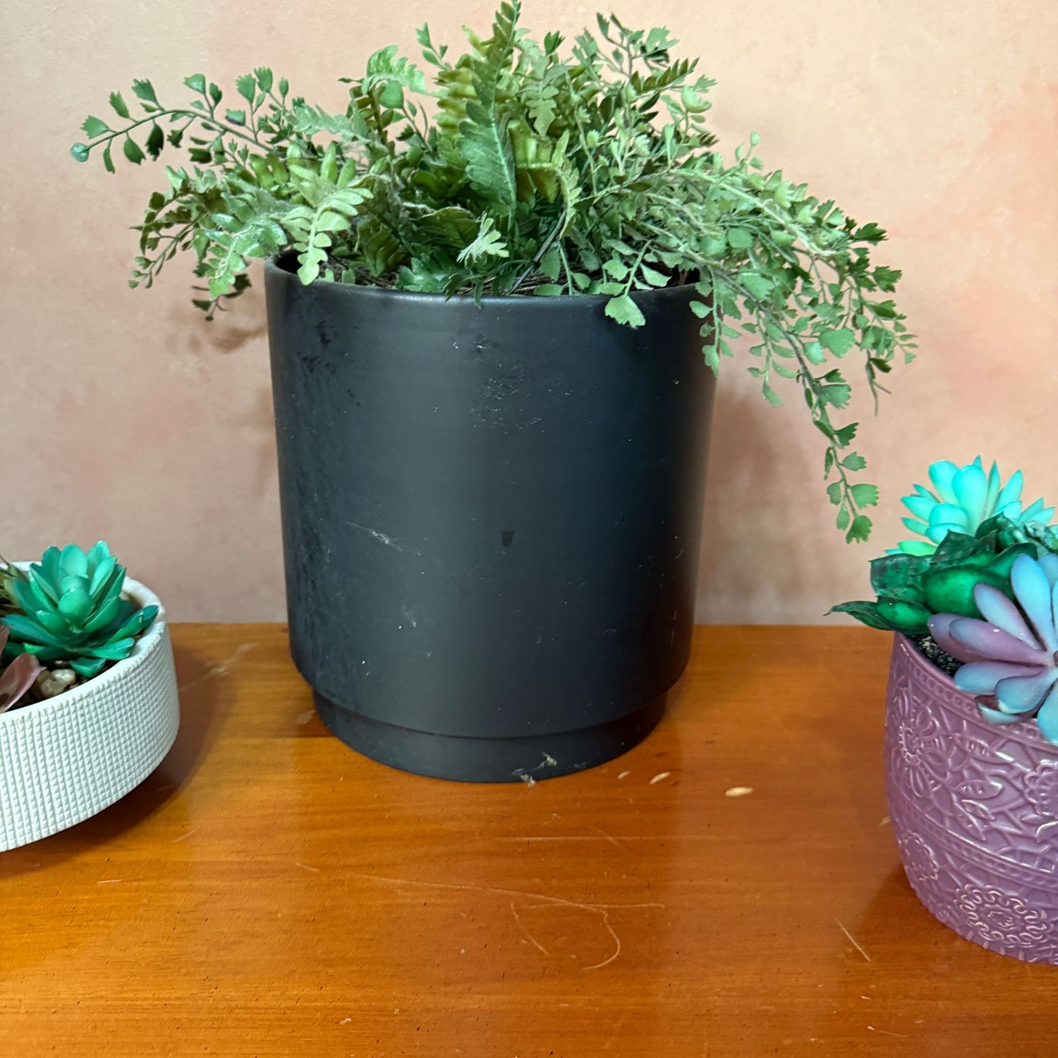 Black metal planter with faux fern 10"H