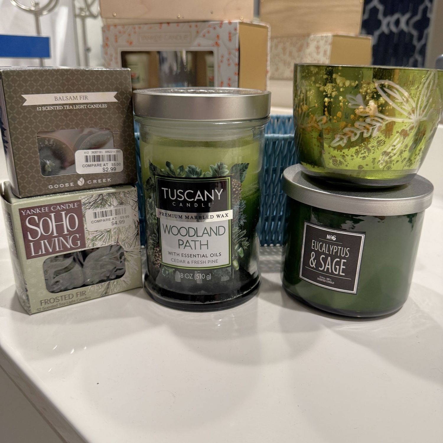 Balsam, cedar, eucalyptus candles in light blue basket