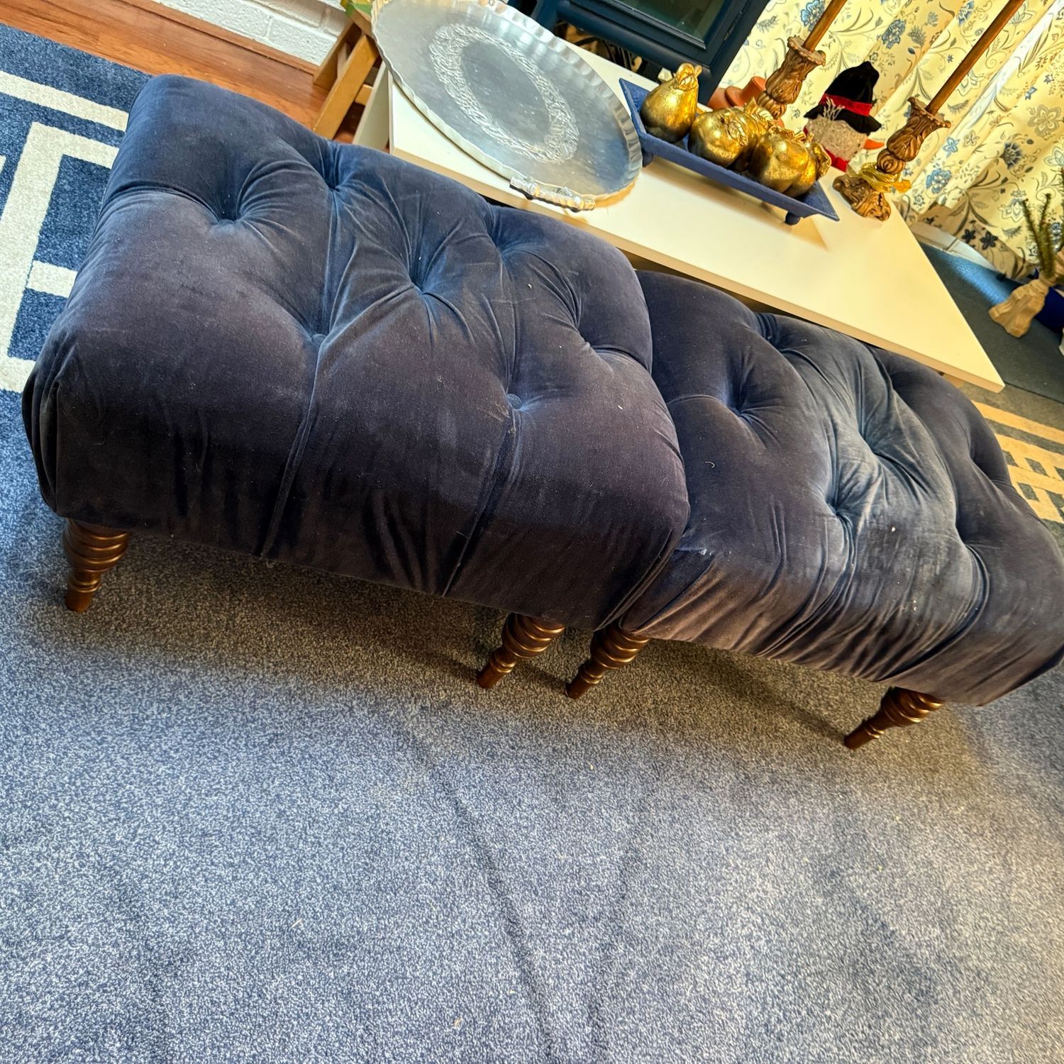 Pair of tufted blue ottomans with dark wood legs, fabric needs cleaning 16"H x 23"W x 19"D