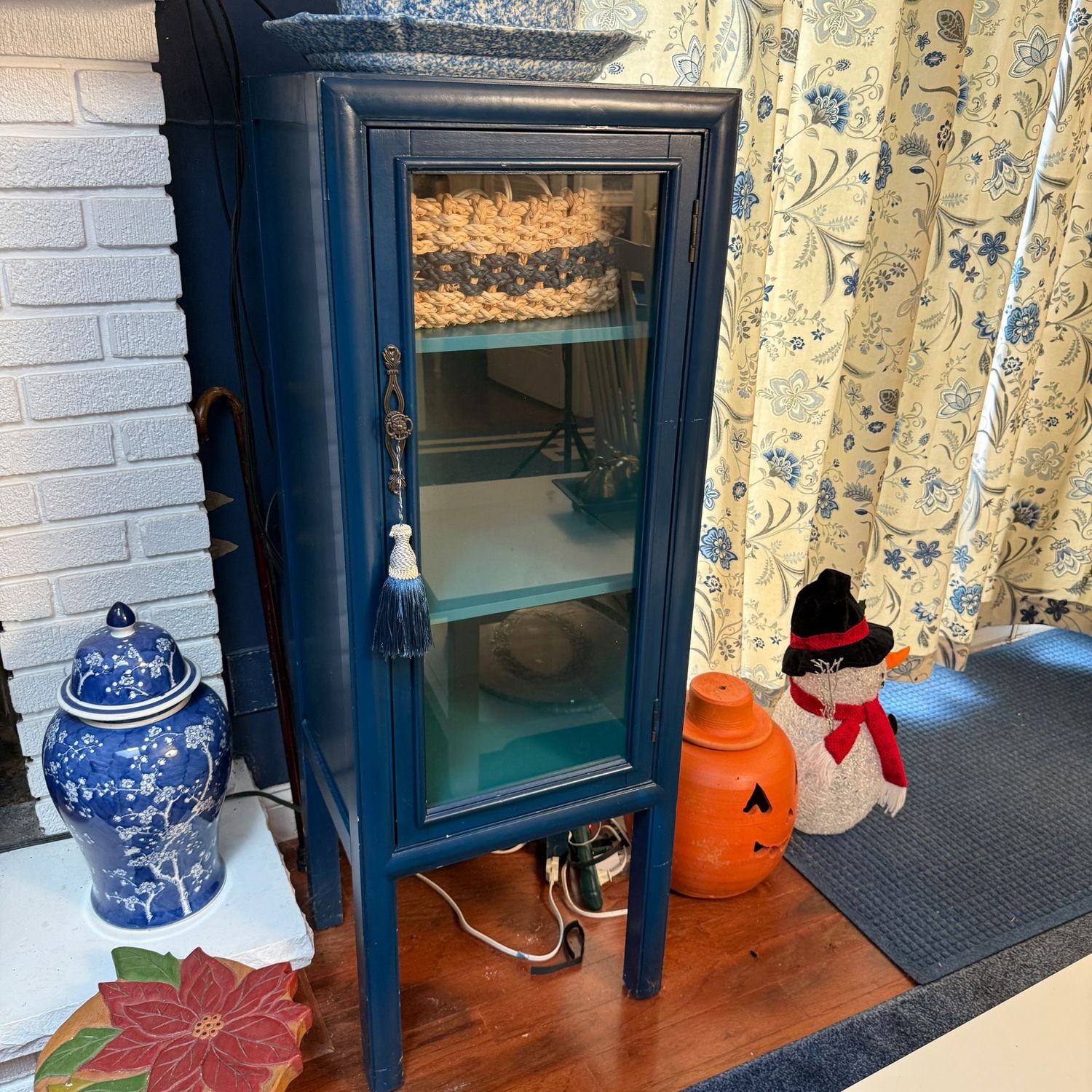 Blue wooden 3-shelf curio cabinet (likely Pier 1) 50"H x 19"W x 14"D