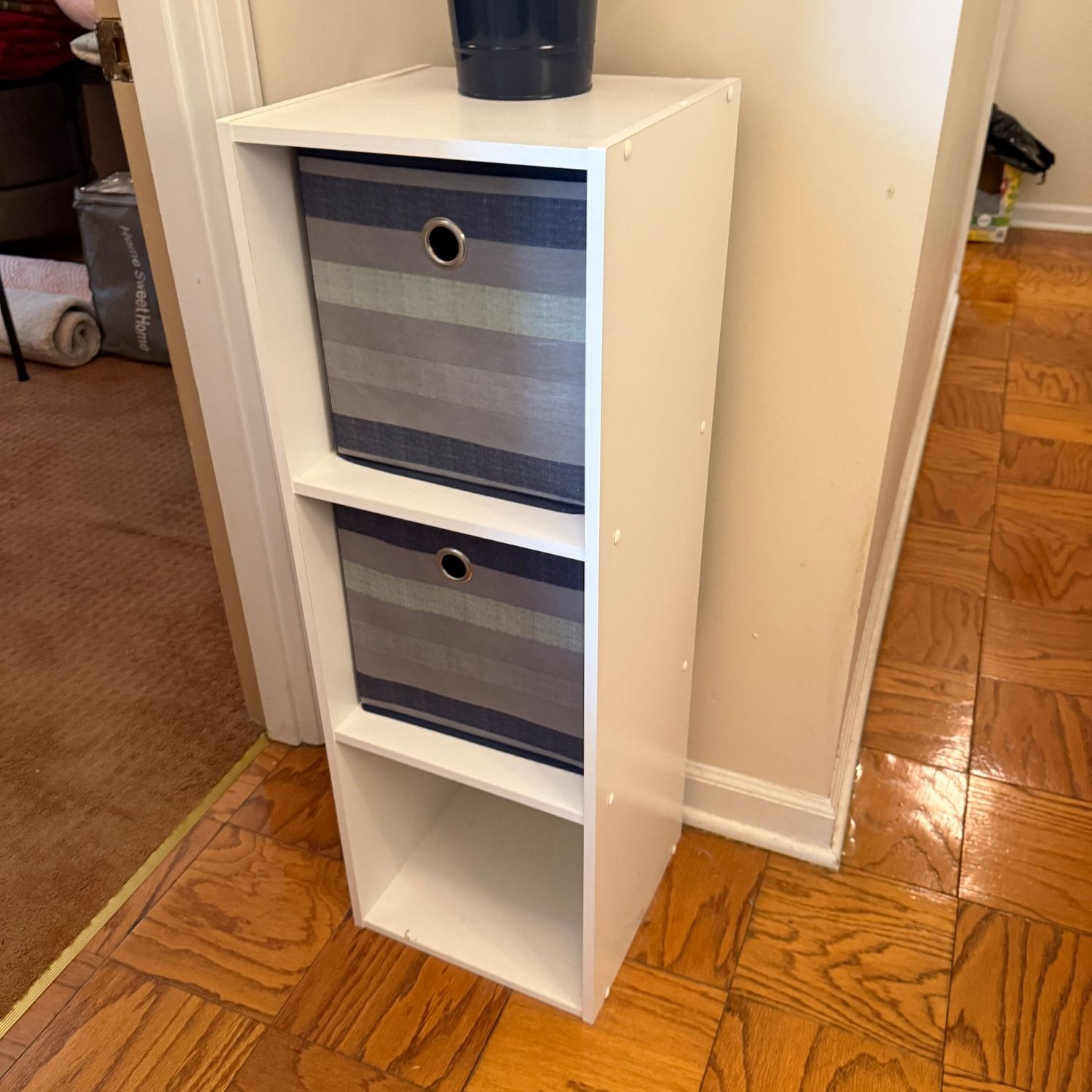 White laminate shelf with 2 storage bins 35"H x 13"W