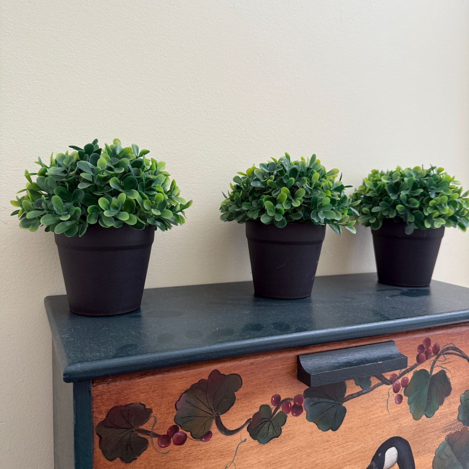 Three lightweight planters with faux leafy bushes 5"H
