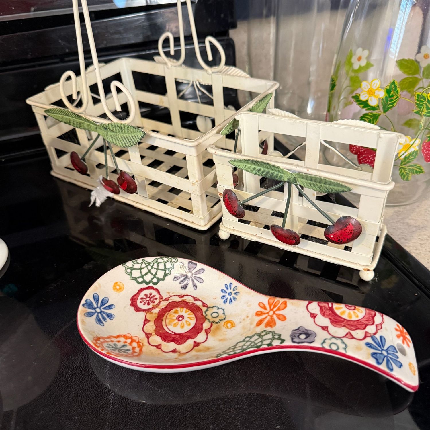 Metal napkin holders and floral ceramic spoon rest