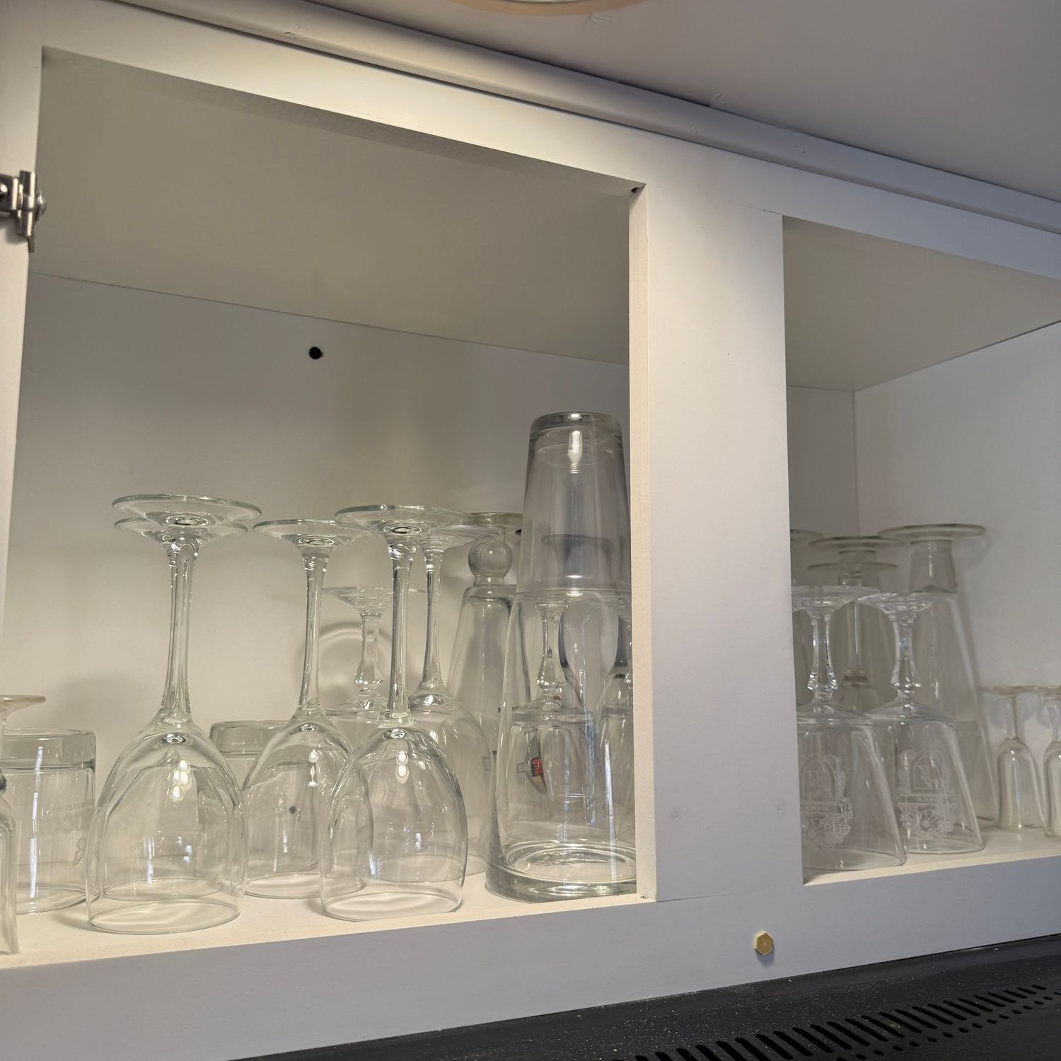 Cabinet of clear stemware and glasses