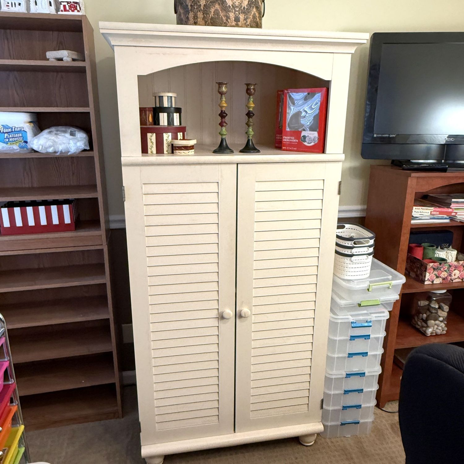 Cream cabinet with louver doors, a little wear, very sturdy 70"H x 32"W x 26"D