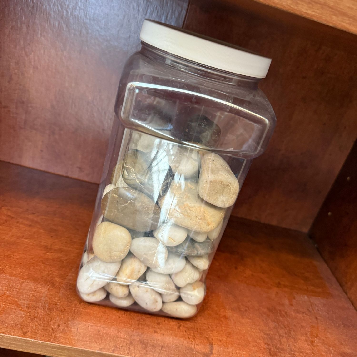 Container of decorative smooth stones, approx 8"H