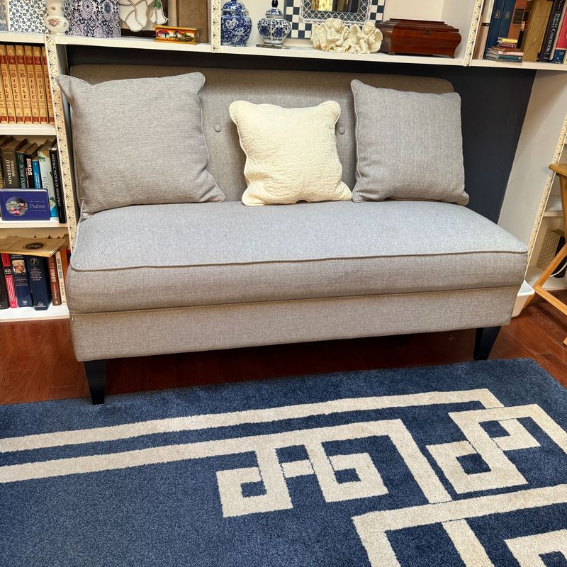 Grey loveseat, very pretty, has a minor weakness on one side of back (ok if against a wall) 34"H x 56"L x 28"D