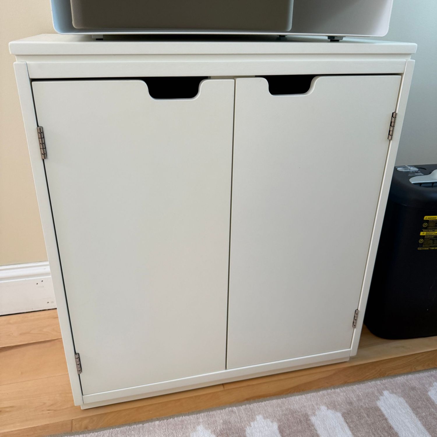 White Pottery Barn 2-door office cabinet with receptacle openings in the back 24"H x 23"W x 14"D
