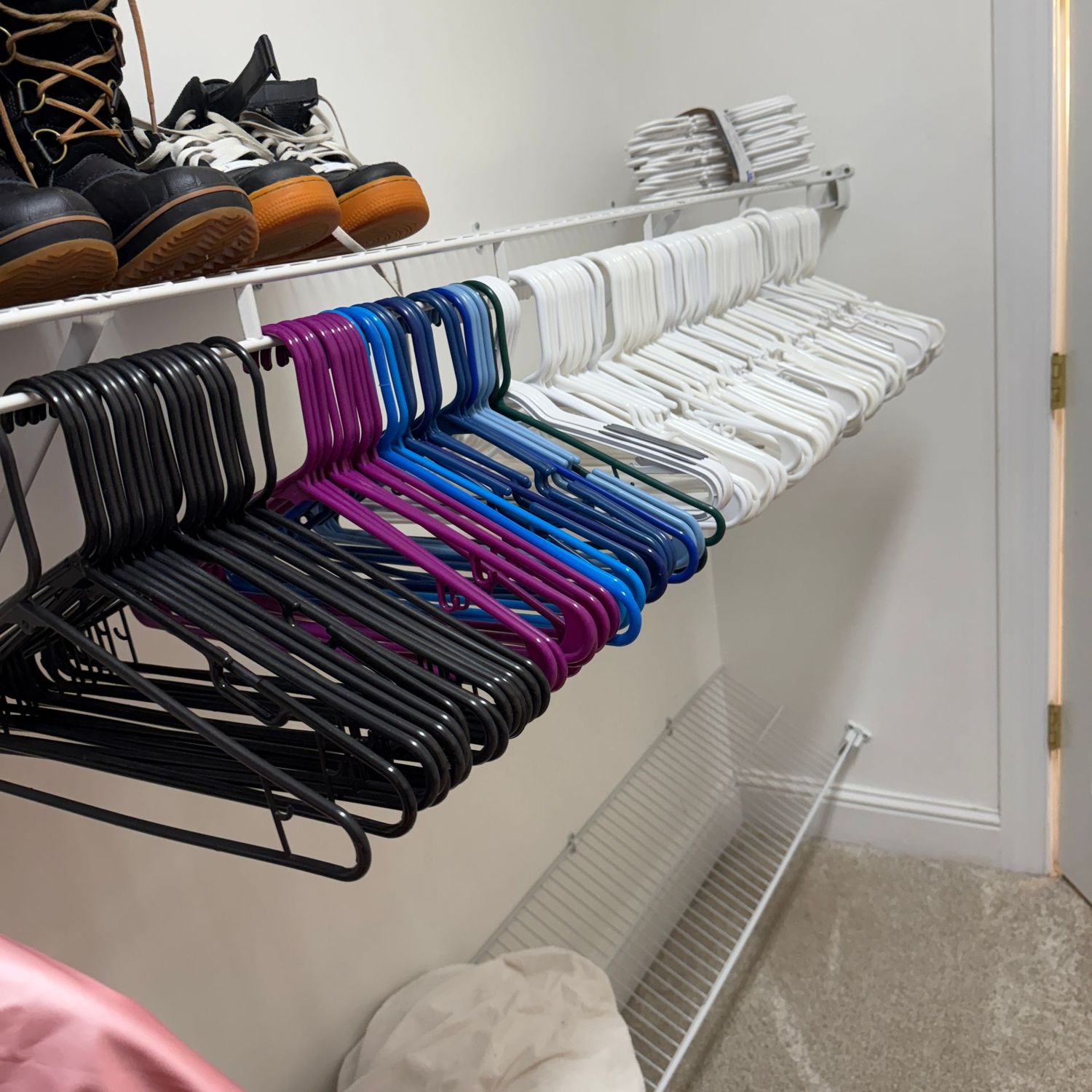 Large group of plastic clothes hangers