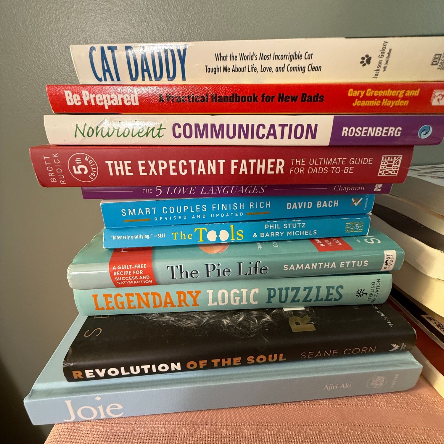 Group of books including Expectant Father and Revolution of the Soul