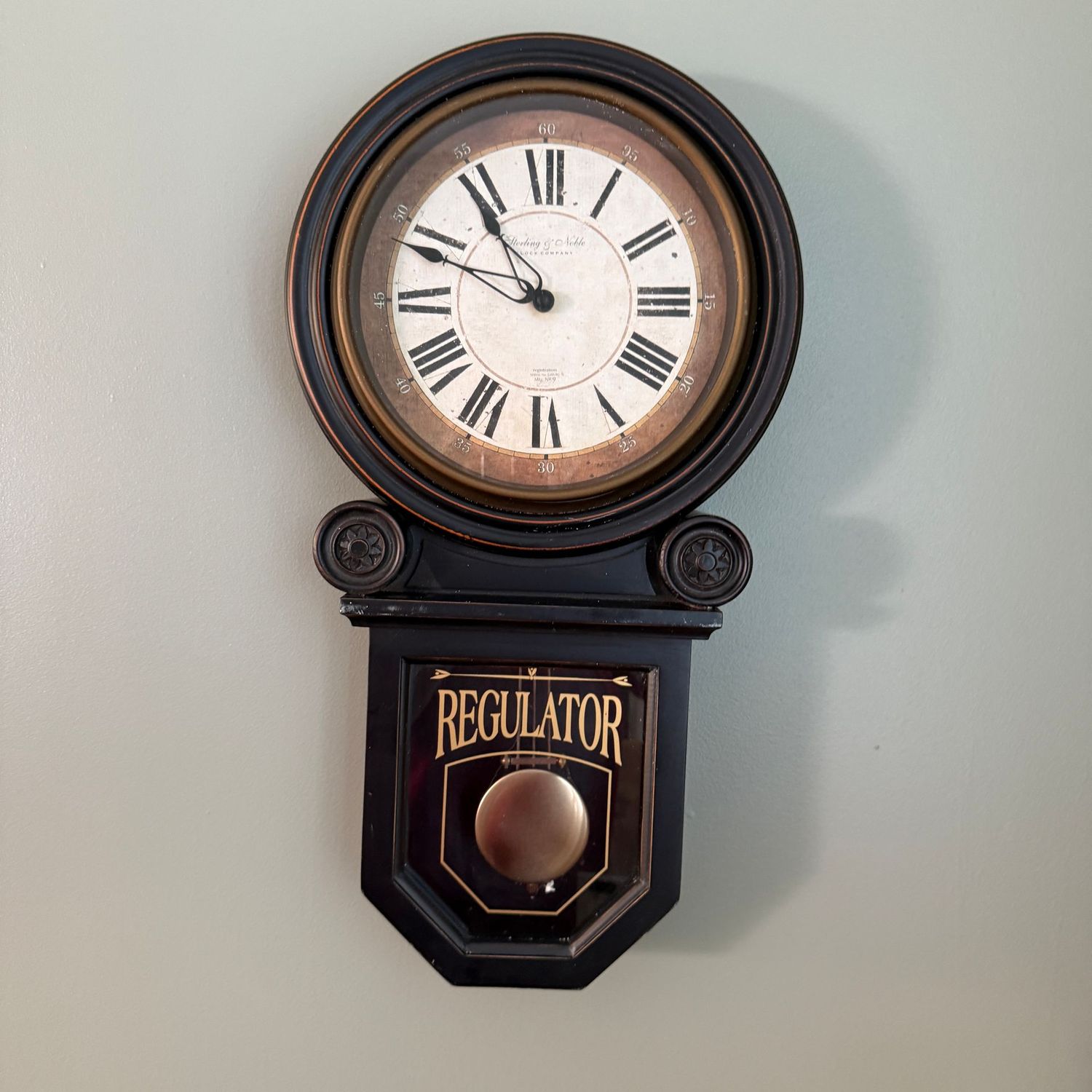 Battery-operated regulator wall clock with plastic frame 24"H
