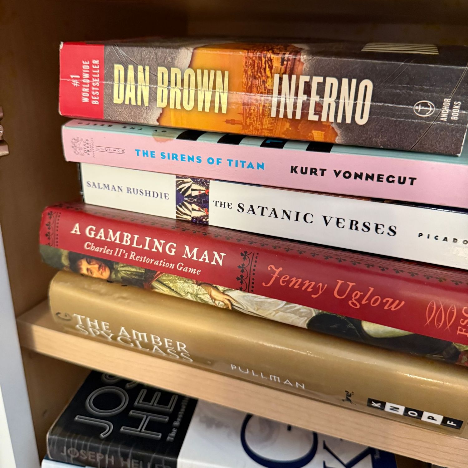 Group of books including The Sirens of Titan and The Amber Spyglass