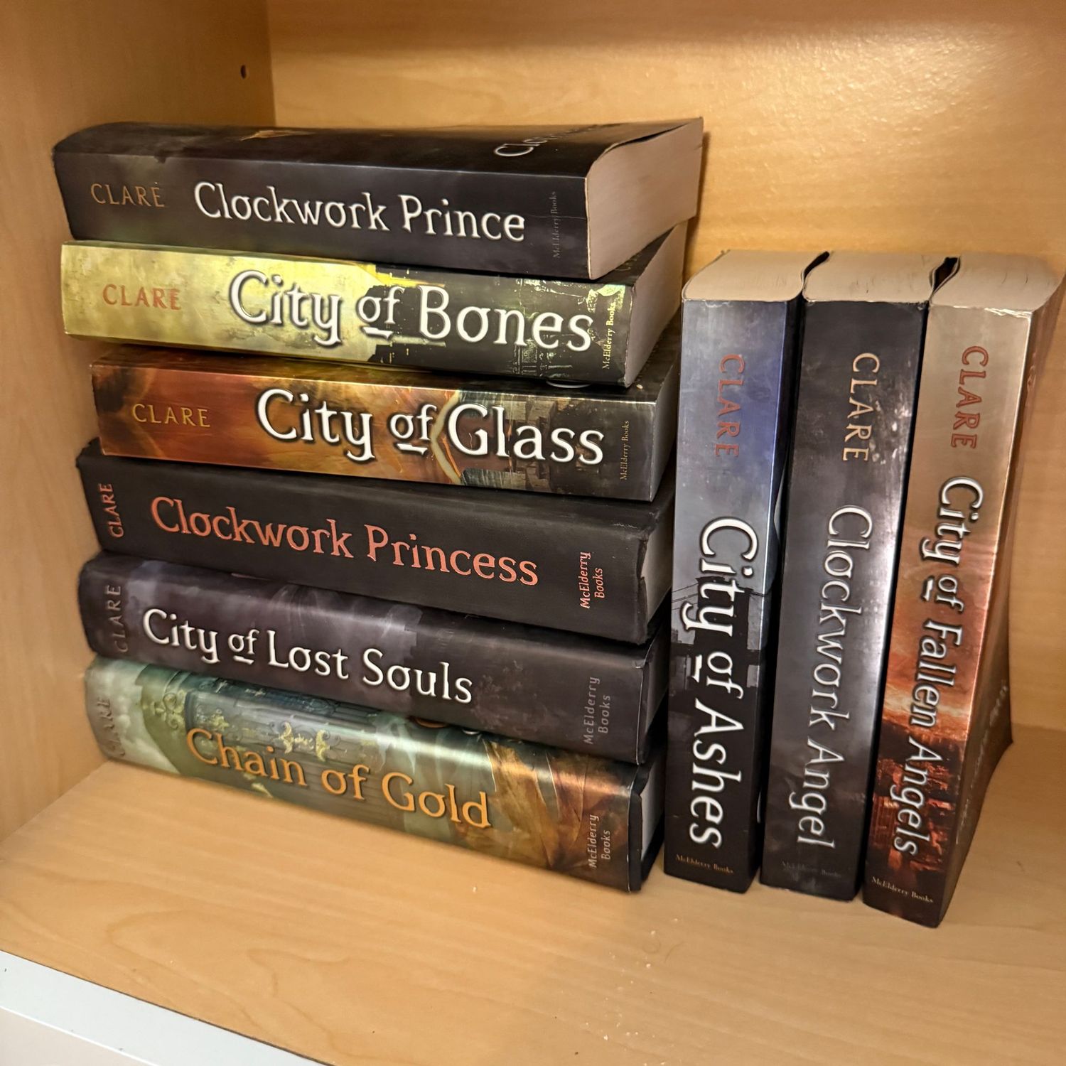Group of books including Clockwork Prince and Chain of Gold by Clare