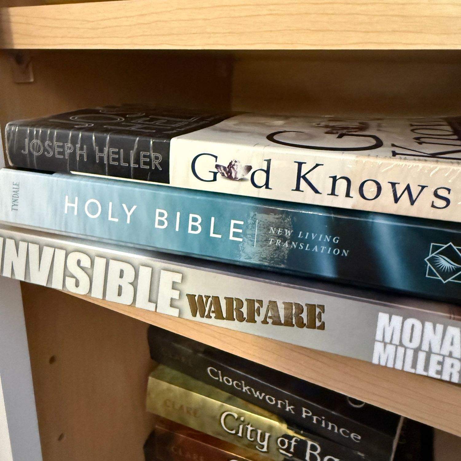 Group of books including God Knows