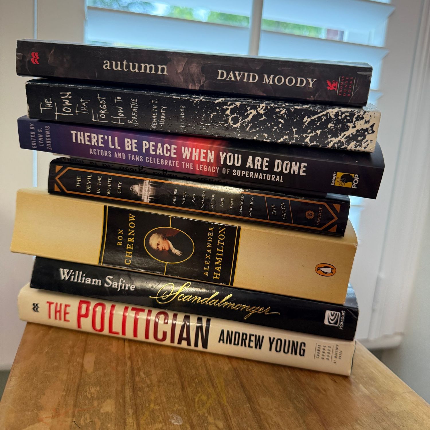 Group of books including Autumn and The Politician