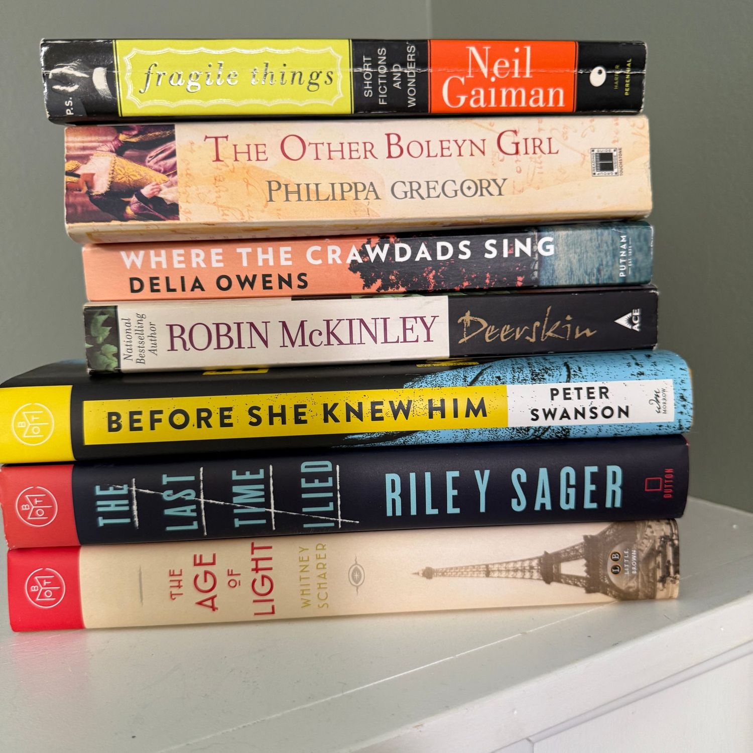 Group of books including Fragile Things and The Age of Light