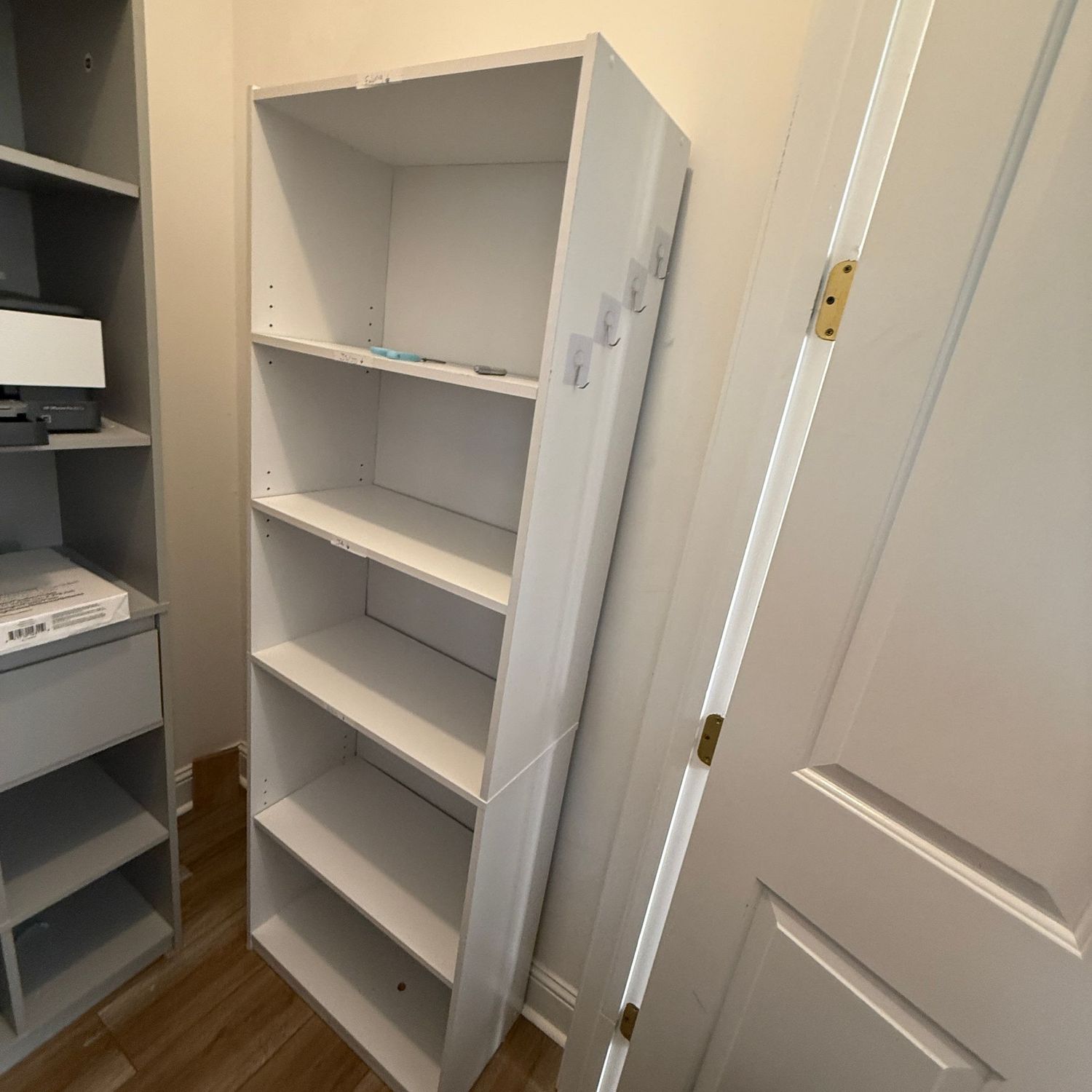 White laminate bookshelf, adjustable shelves, some wear & stickers (R)  5'9"H x 12"D x 24"W