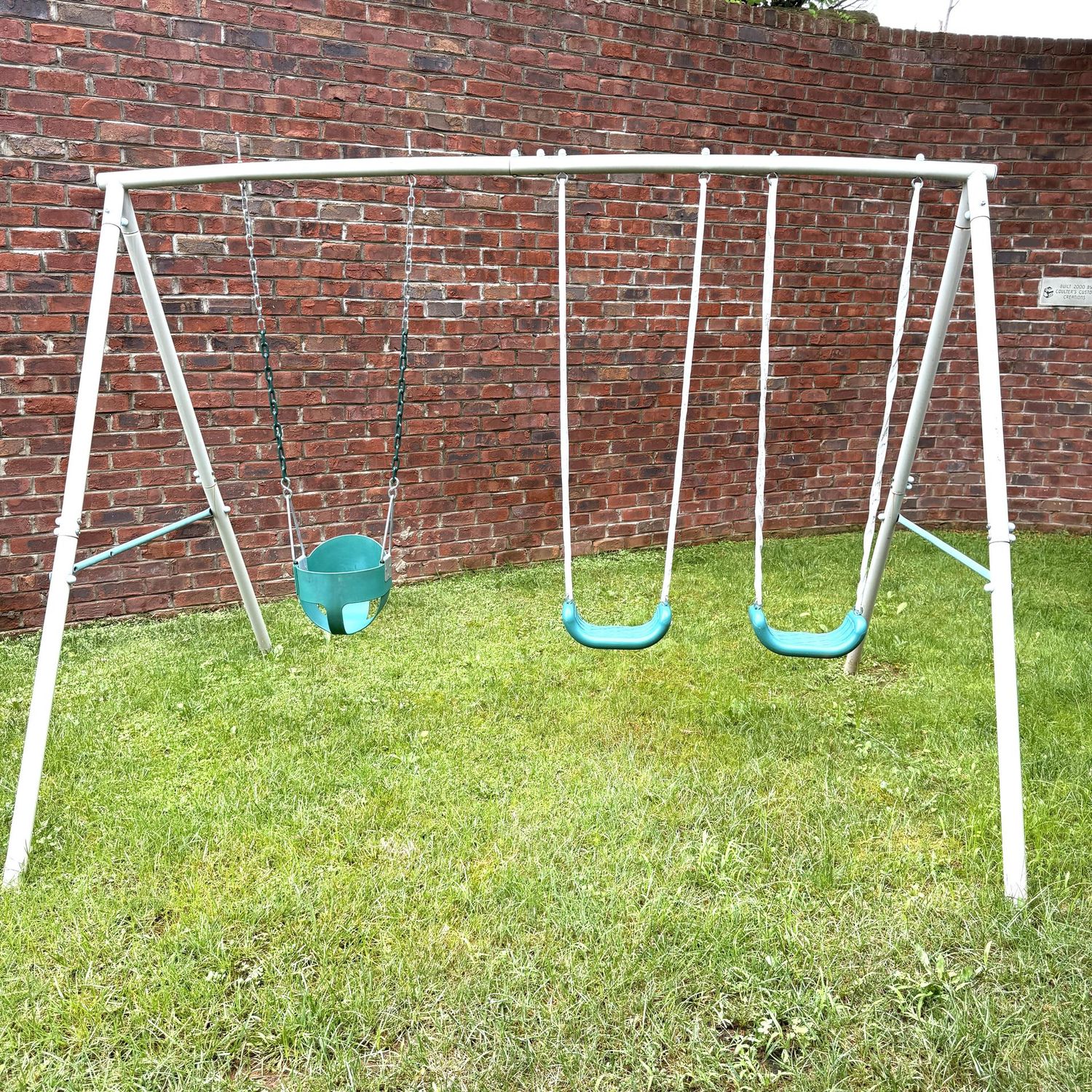 Metal swingset for smaller children, poles disassemble for moving  6.5'H x 8.2'L x 5.8'D