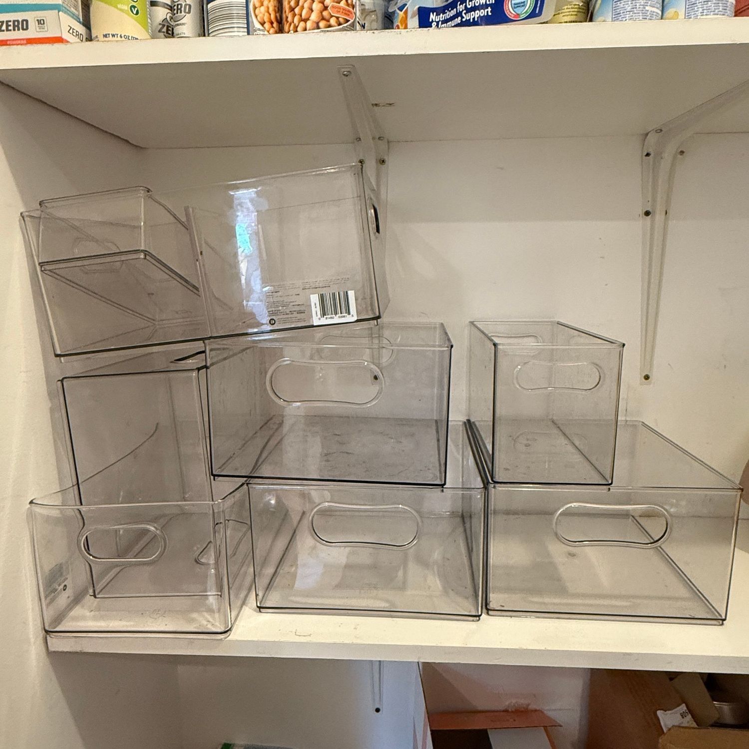 Group of clear plastic bins for pantry, a few have slight bowing, still great shape otherwise