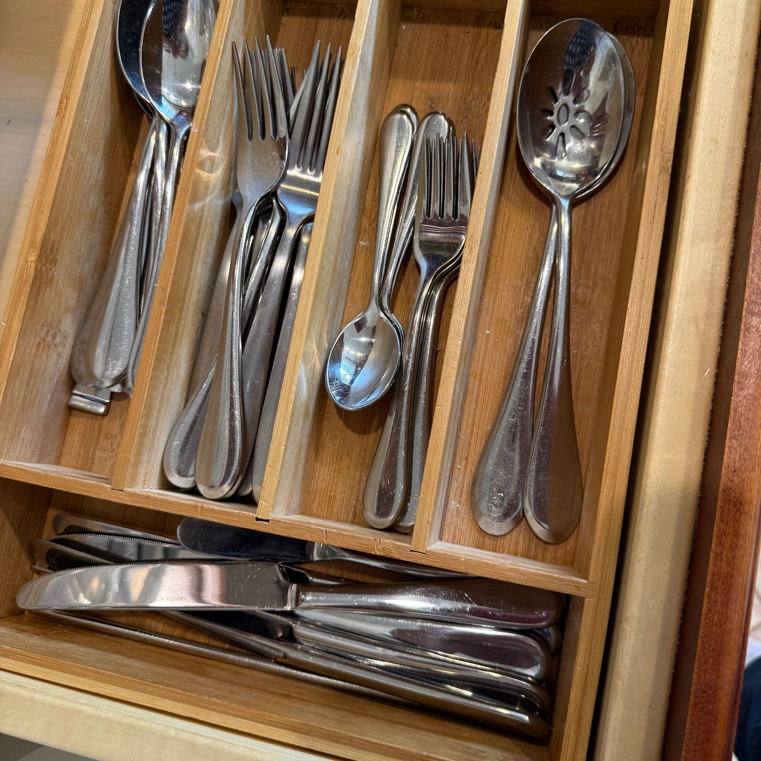 Oneida stainless flatware and wooden drawer organizer