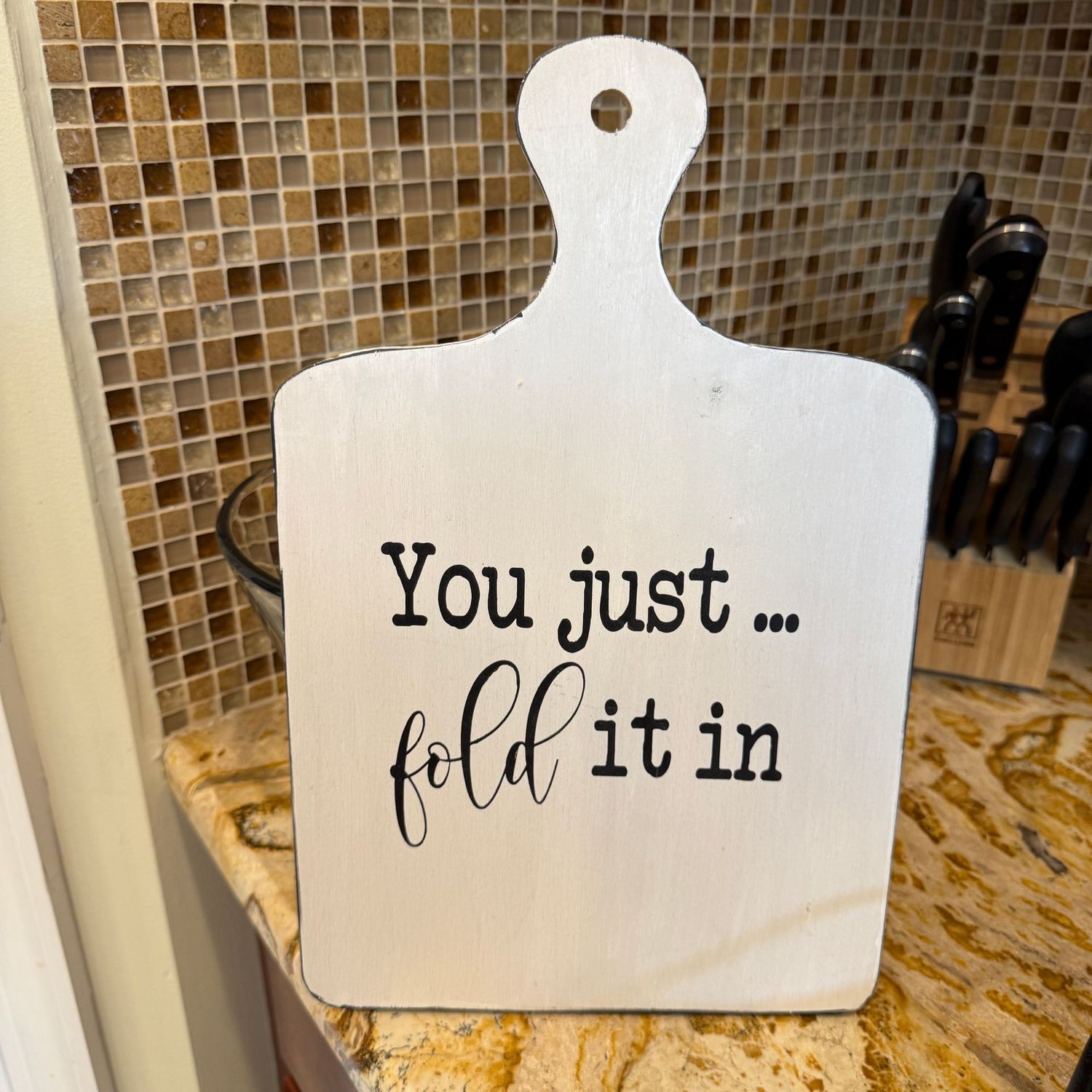 You just fold it in decorative cutting board 13"H