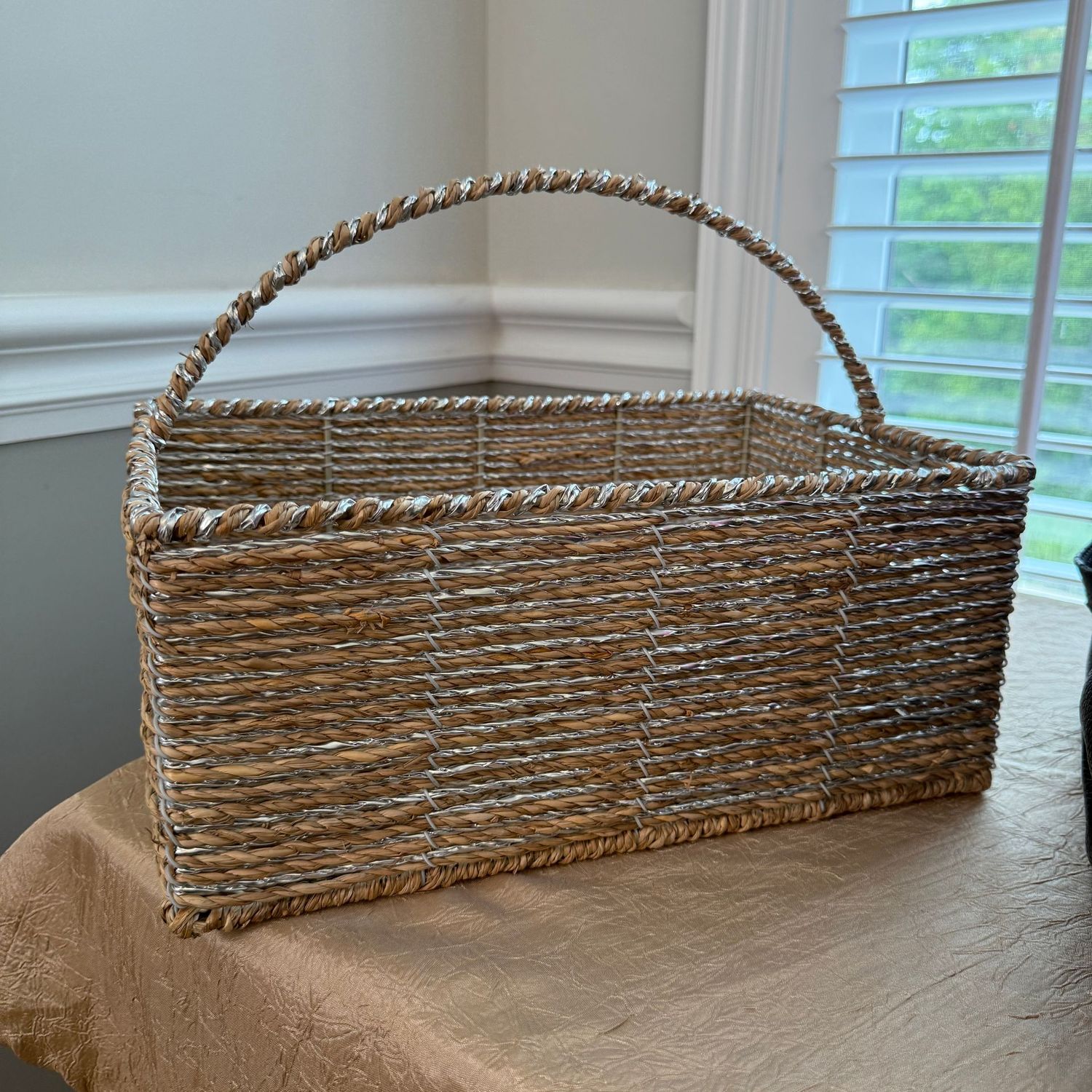 Twisted jute basket with silver strands, over wire construction, body of the basket is 6"H x 13"L x 8"W