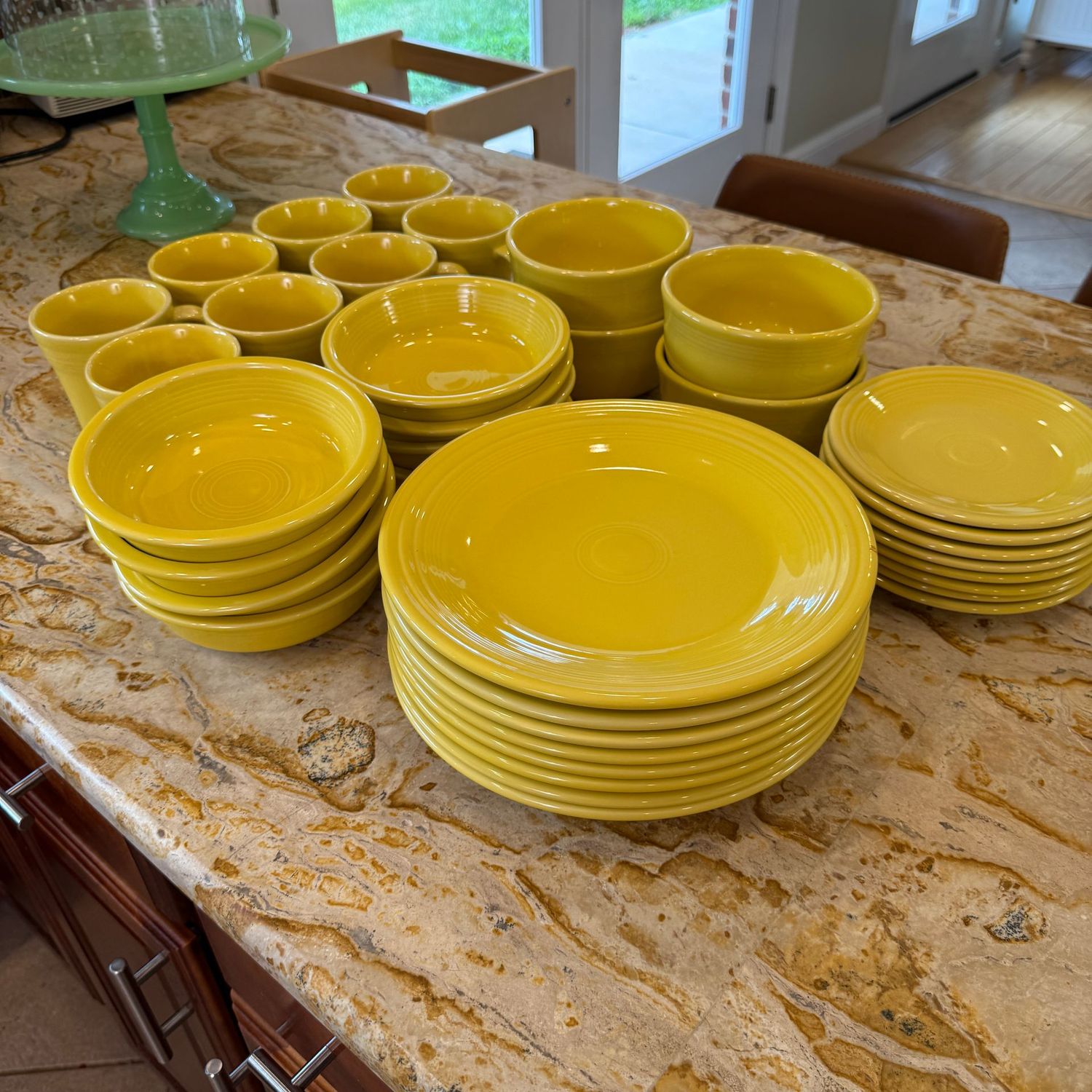 Fiestaware yellow with coffee mugs (show some minor staining), bowls and plates in good condition