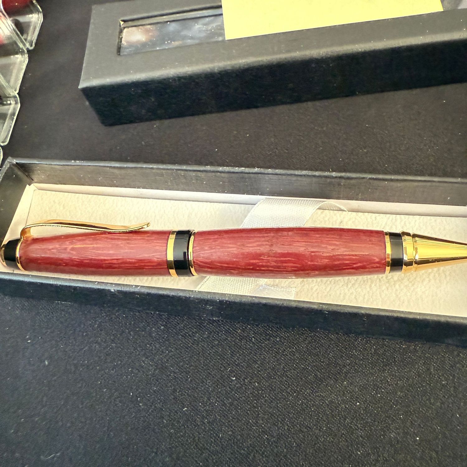 Hand-crafted pen by local artisan (R) wooden body