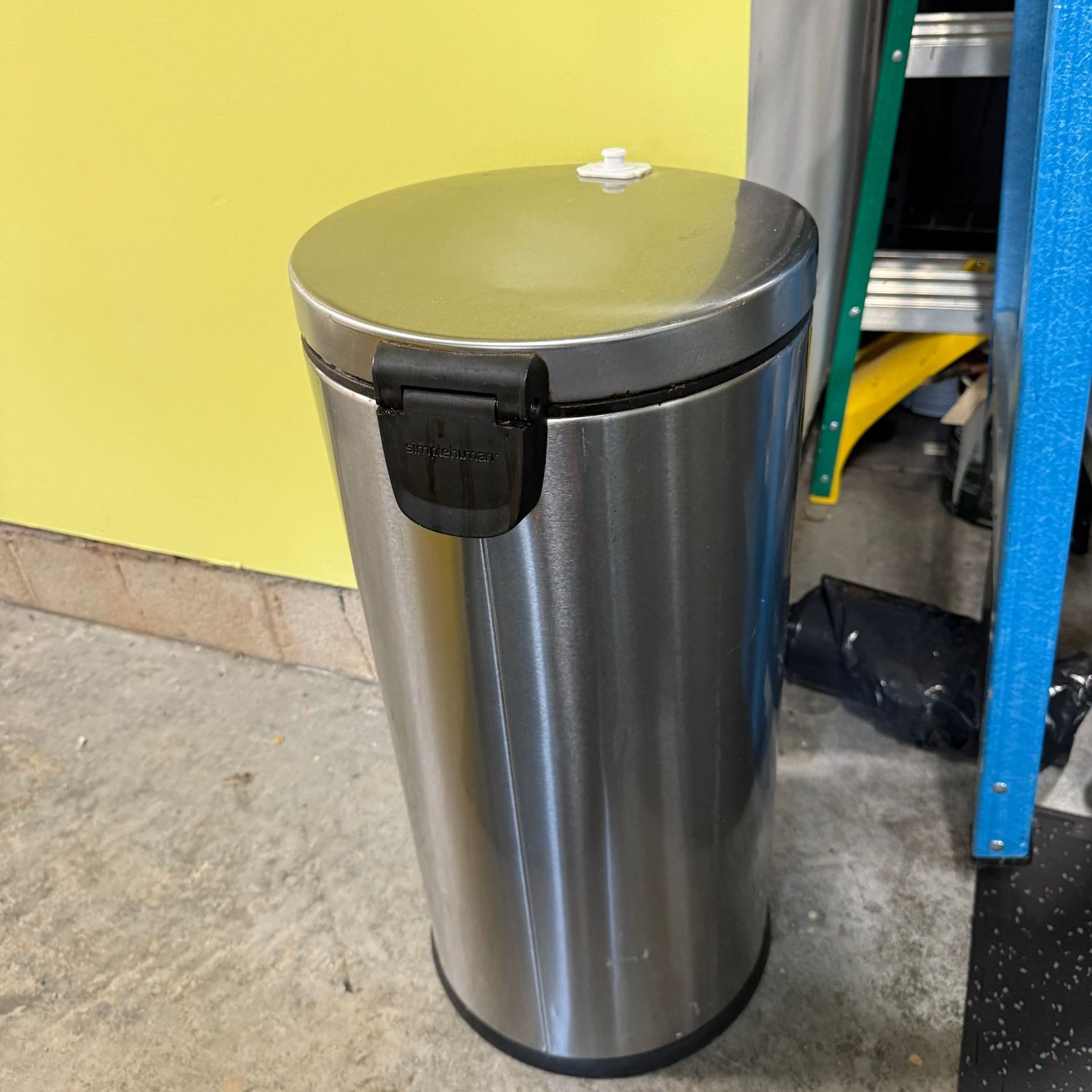 Stainless slender round trash bin, kitchen size (LR) has a latch that could be removed with glue remover 25"H