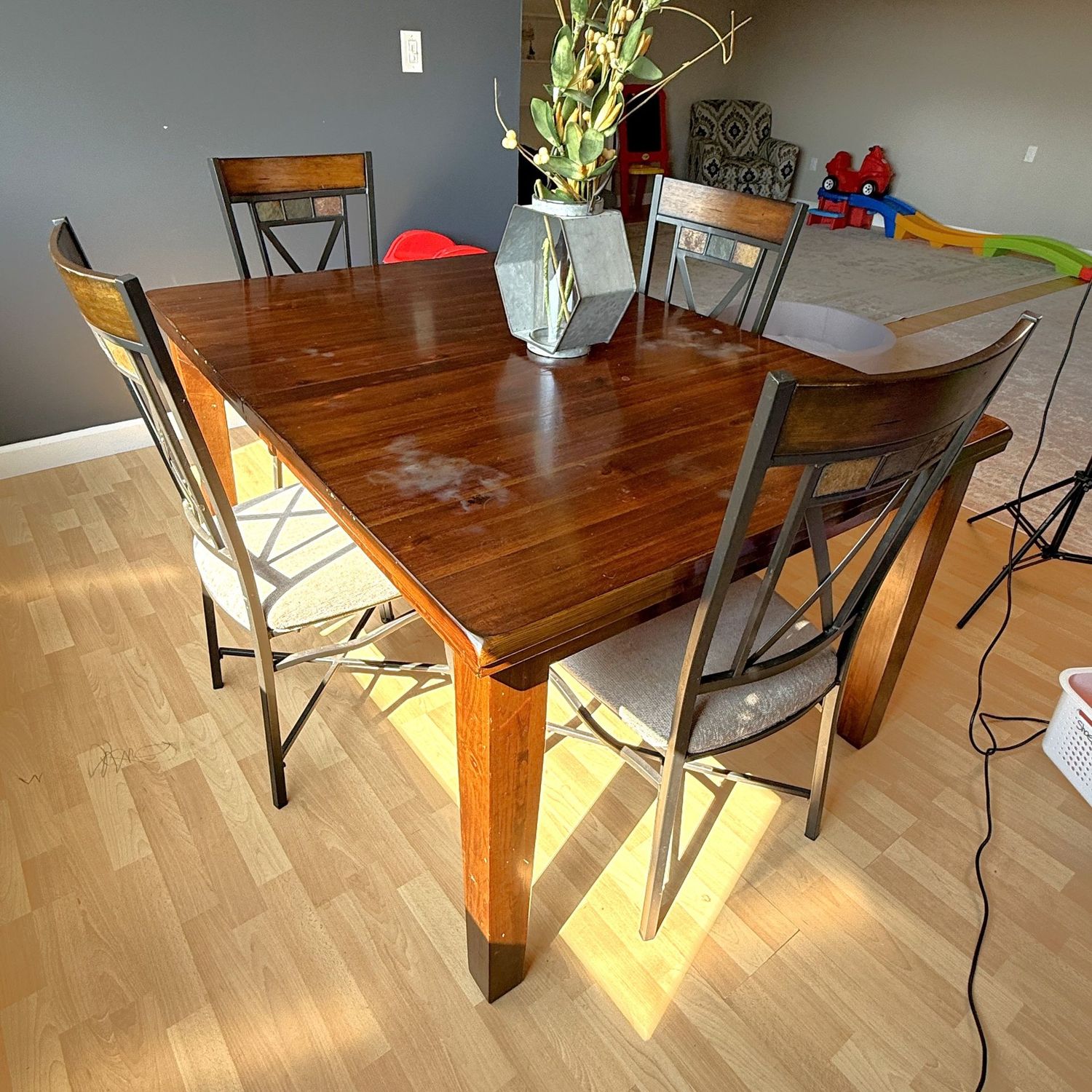 Very sturdy wood dining table, cloth seats need light cleaning, does have a leaf underneath, table surface shows some wear 60" x 42" (This item is upstairs)