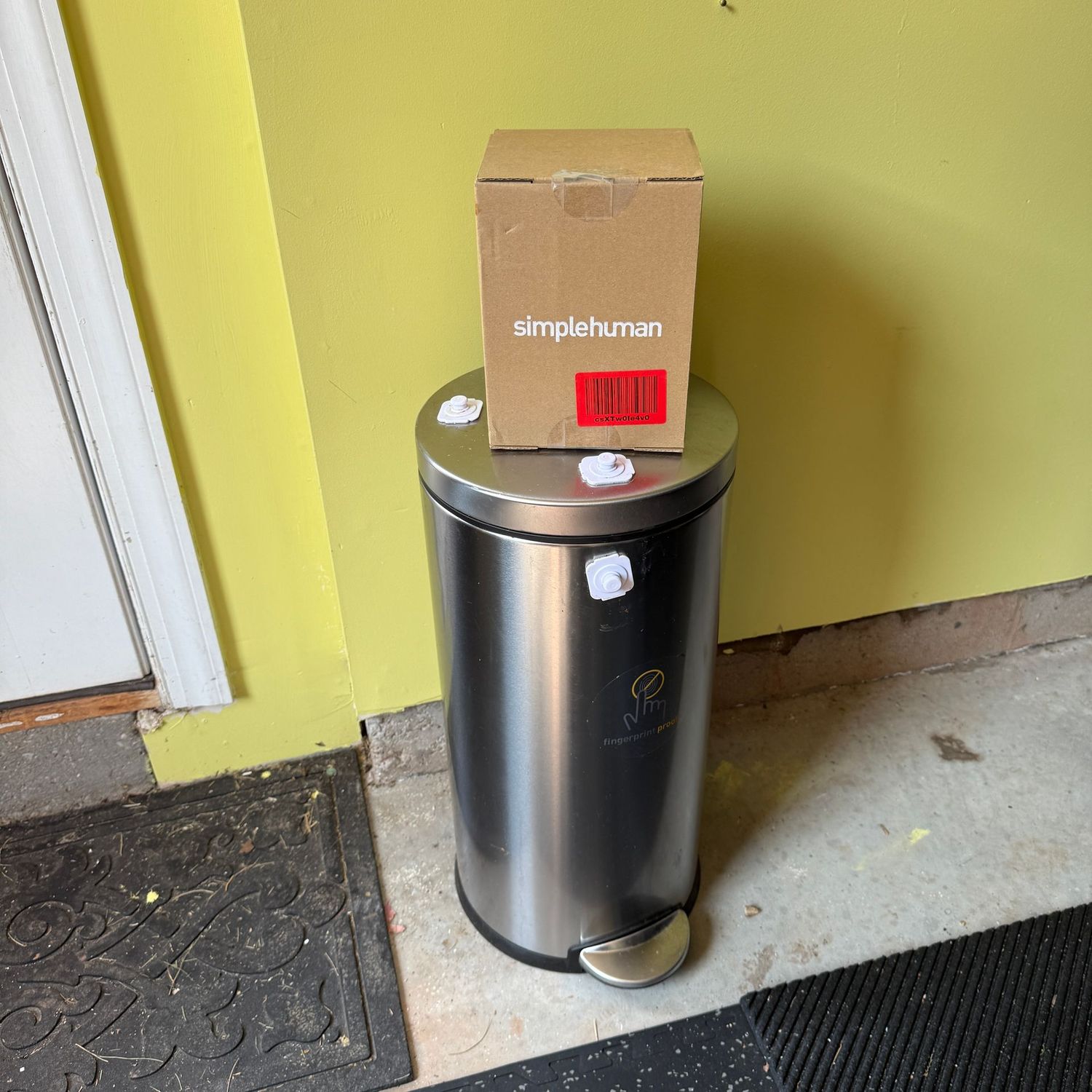 Stainless slender round trash bin, kitchen size (GA) has a latch that could be removed with glue remover approx. 25"H Comes with a box of liners (approx. 4 pgs of 20)