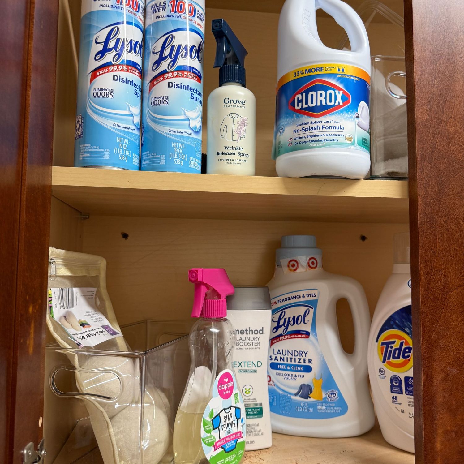 Group of cleaners and laundry detergent, most are full or half-full
