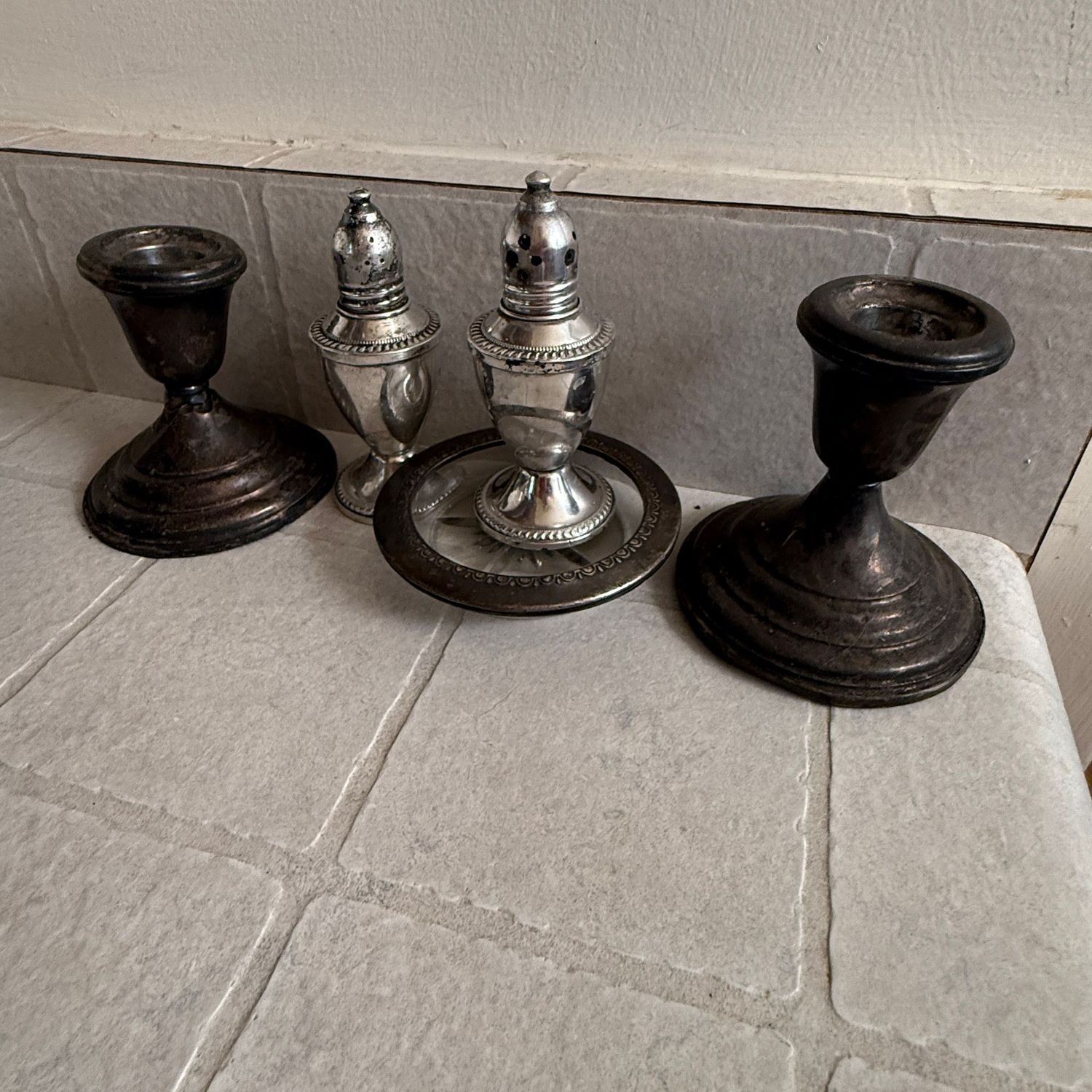 Group of weighted sterling salt & pepper shakers, candlesticks, coaster Group of weighted sterling salt & pepper shakers, candlesticks, coaster