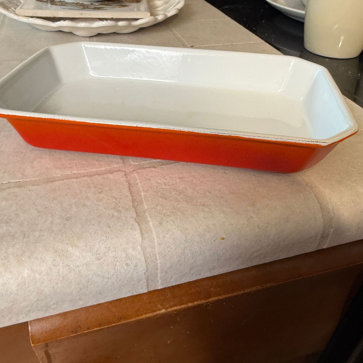 Orange and white Belgium, coated cast iron small casserole, 8 Orange and white Belgium, coated cast iron small casserole, 8"L