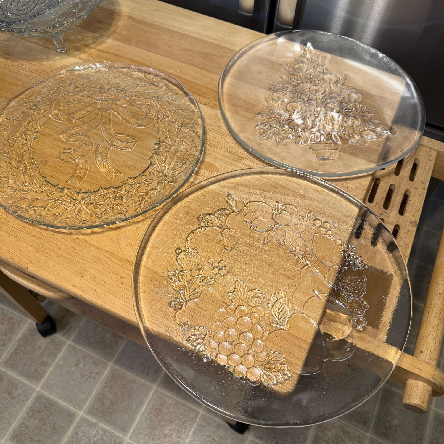 Group of 3 large clear glass platters with fruit, wreath, and Christmas tree, the largest is 13"
