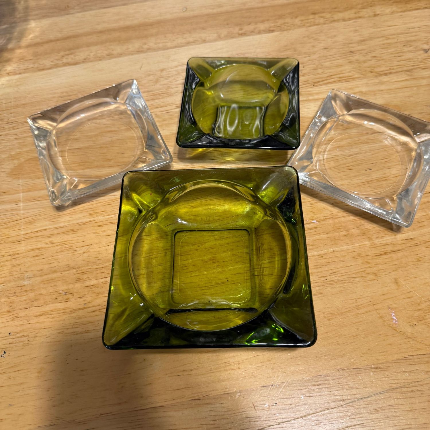 Group of clear and green vintage glass ashtrays Group of clear and green vintage glass ashtrays