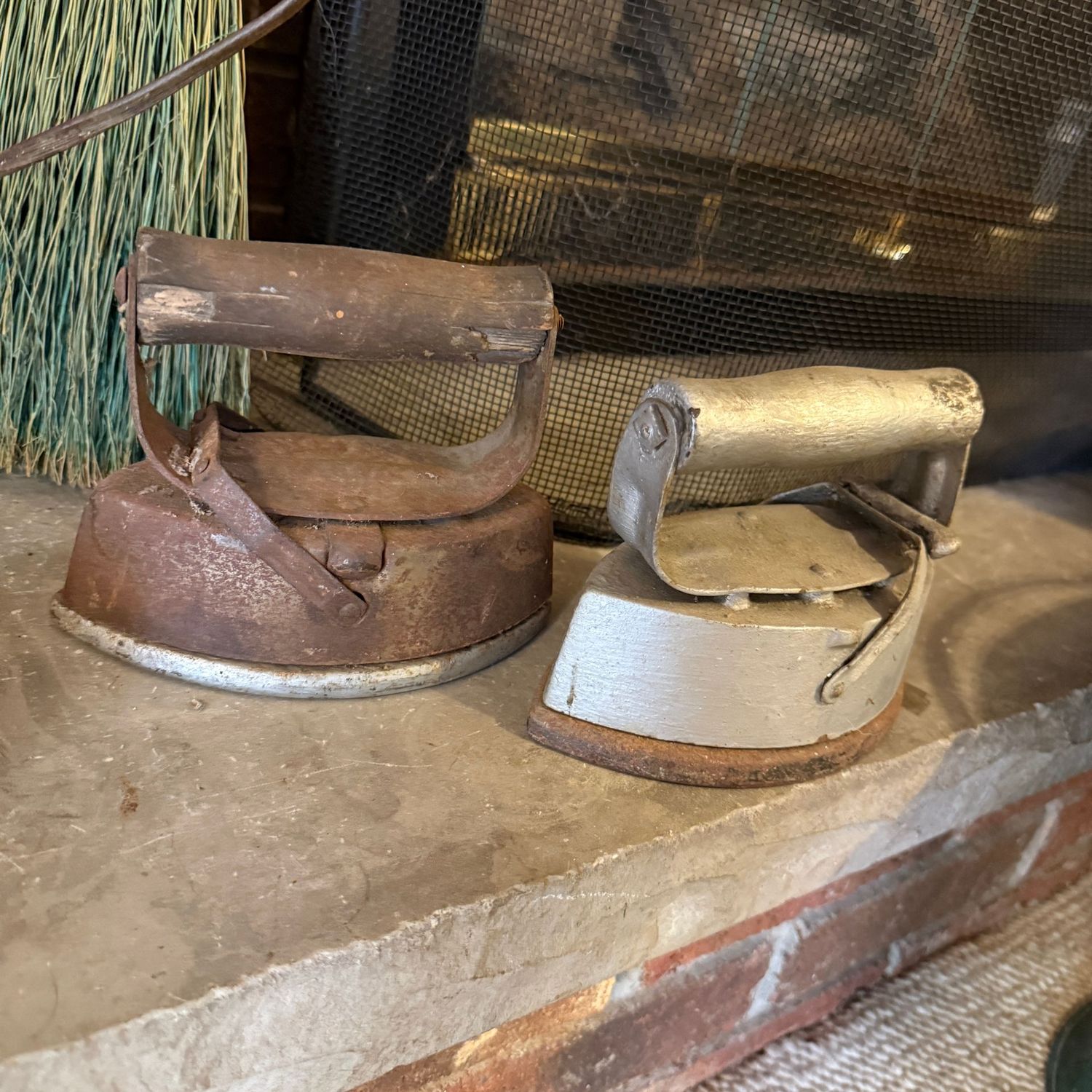 Two sad irons with handles