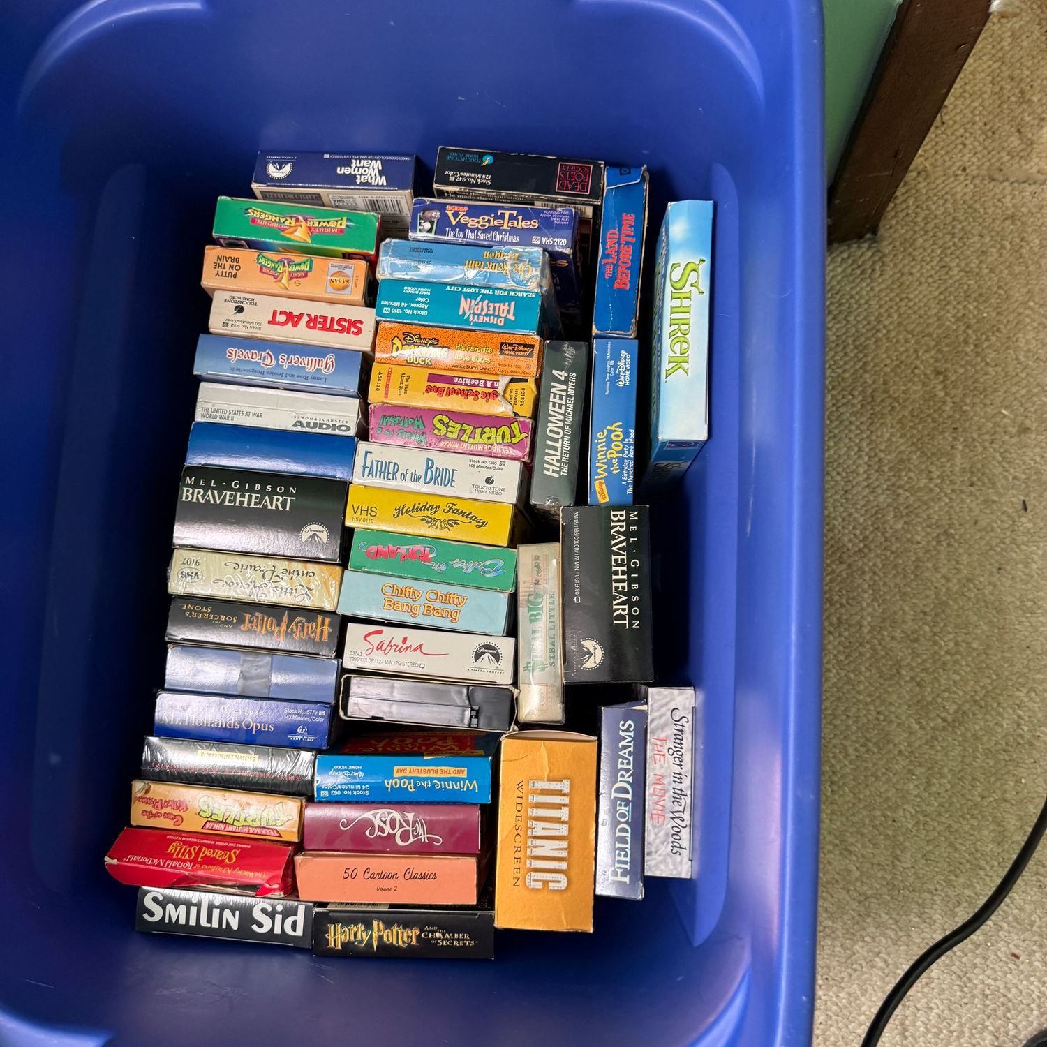 Blue bin with VHS tapes Blue bin with VHS tapes