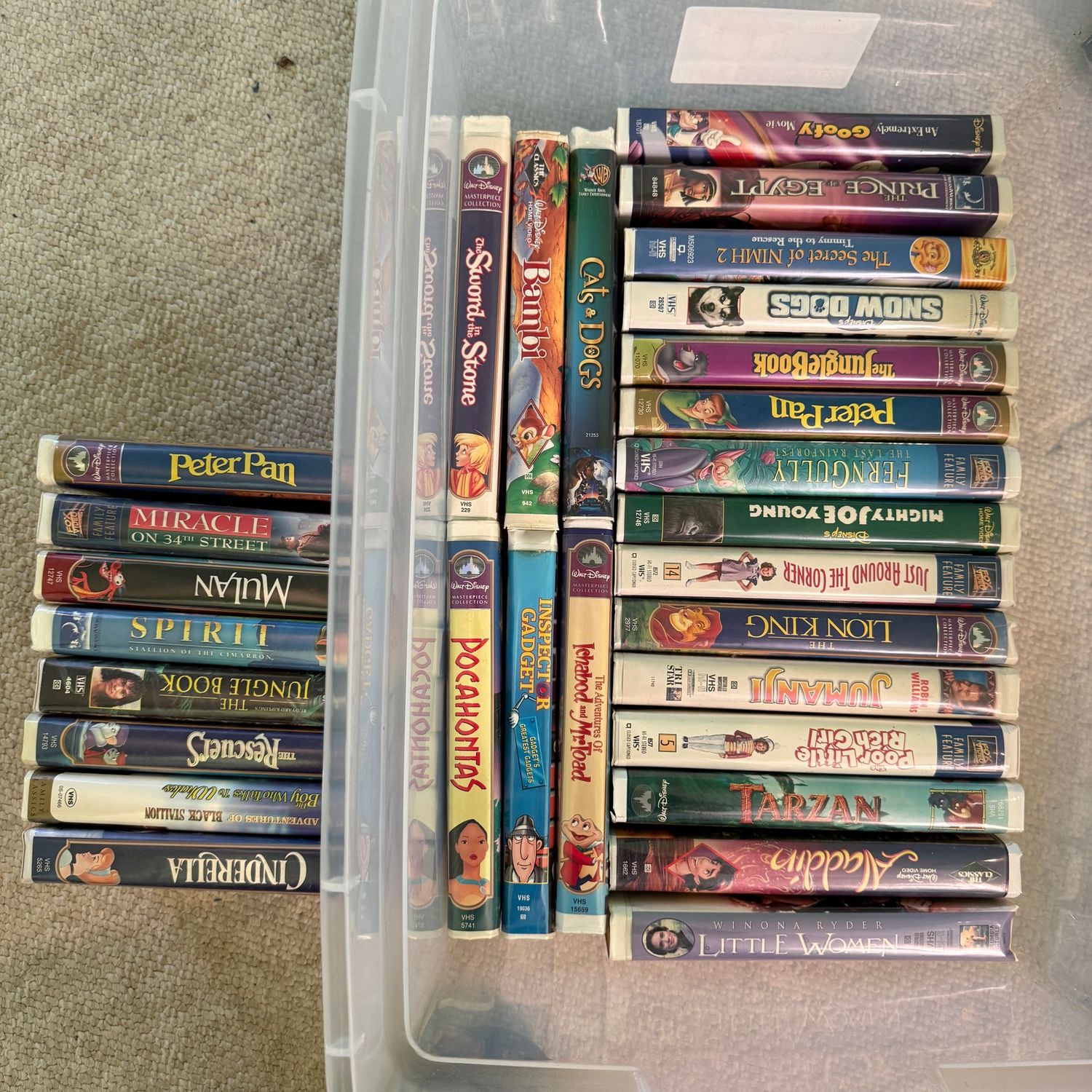 Clear bin of vintage VHS tapes, includes all tapes seen in photos Clear bin of vintage VHS tapes, includes all tapes seen in photos