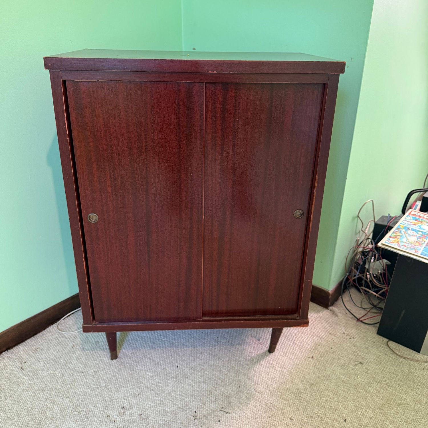 Vintage record album cabinet with sliding doors, some wear, right front leg needs to be possibly glued for stability, 34 Vintage record album cabinet with sliding doors, some wear, right front leg needs to be possibly glued for stability, 34"H x 32"W x 15"D