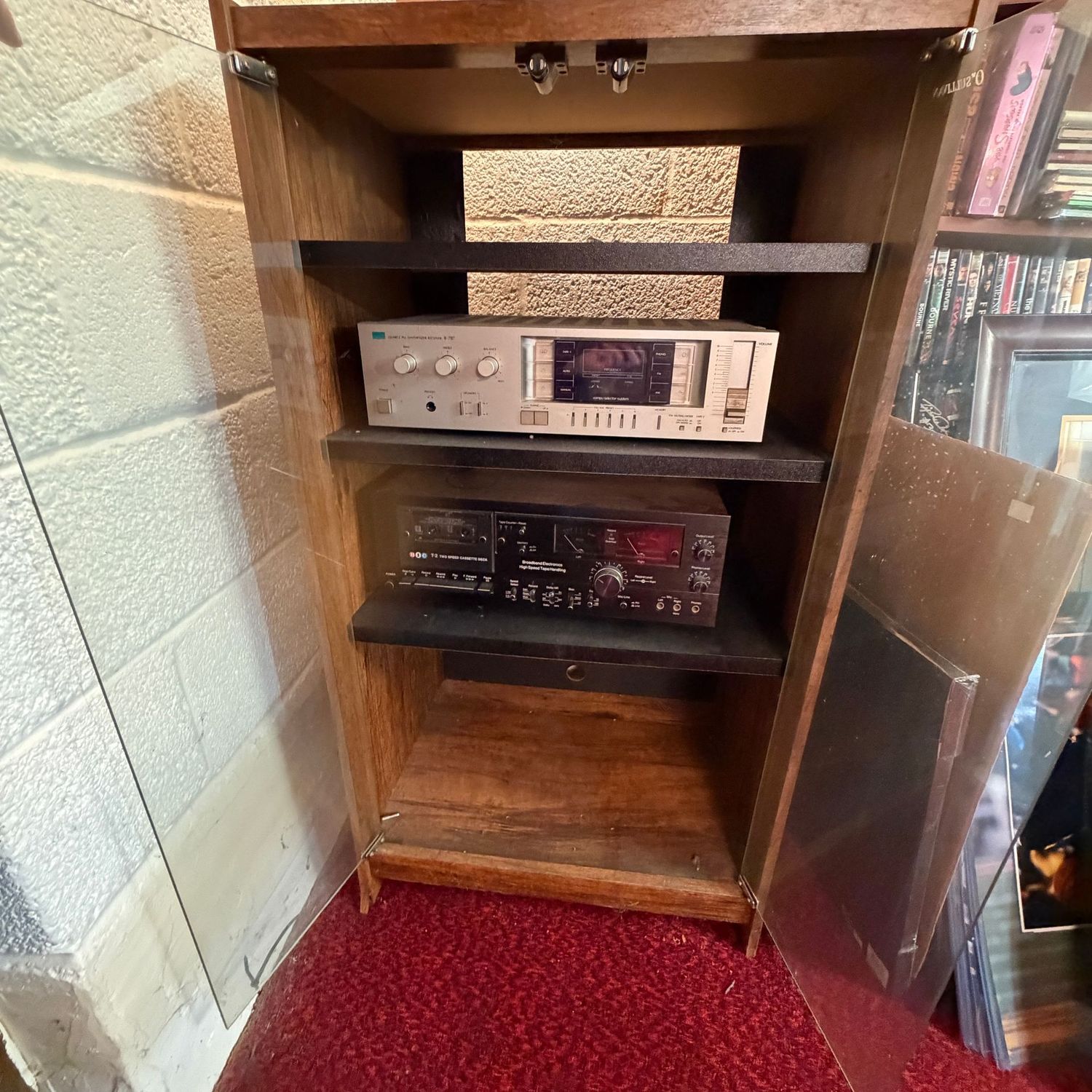 Laminate cabinet with glass doors, some wear but sturdy, (This item is in the lower level), 40"H x 24"W x 15"D