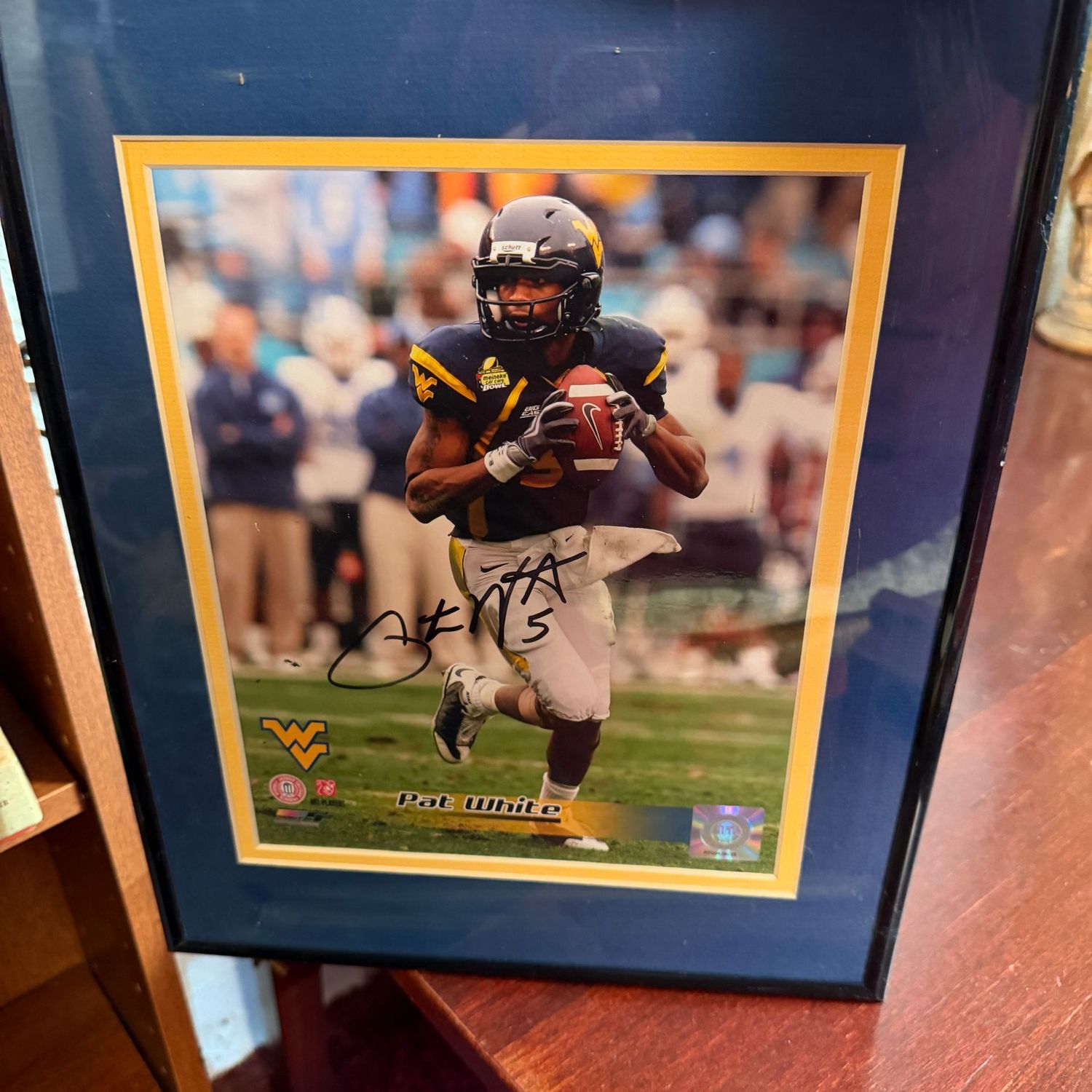 Framed and autographed Pat White photo, 14" x 11.5"