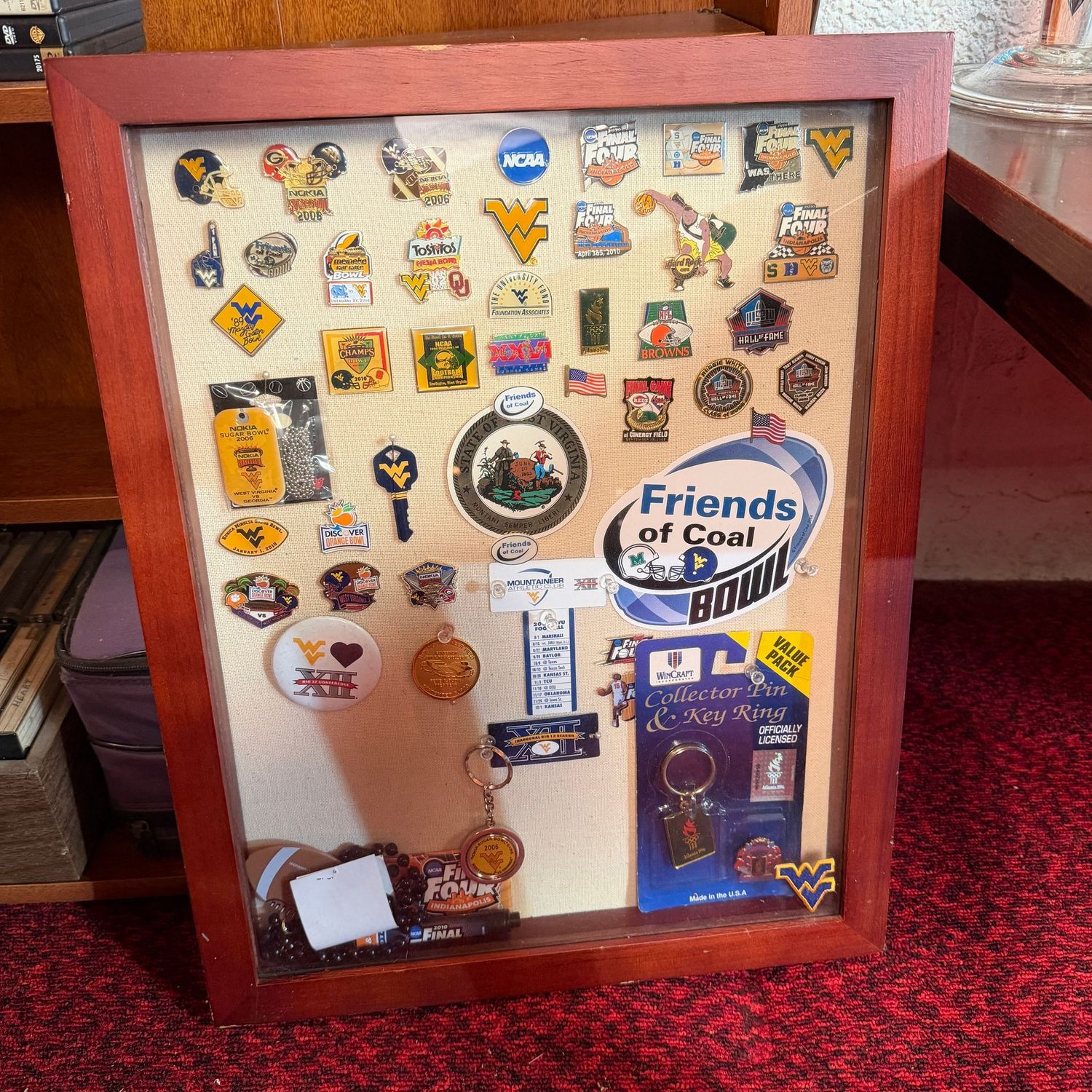 Shadow box with bowl pins and WVU memorabilia, 20" x 16"