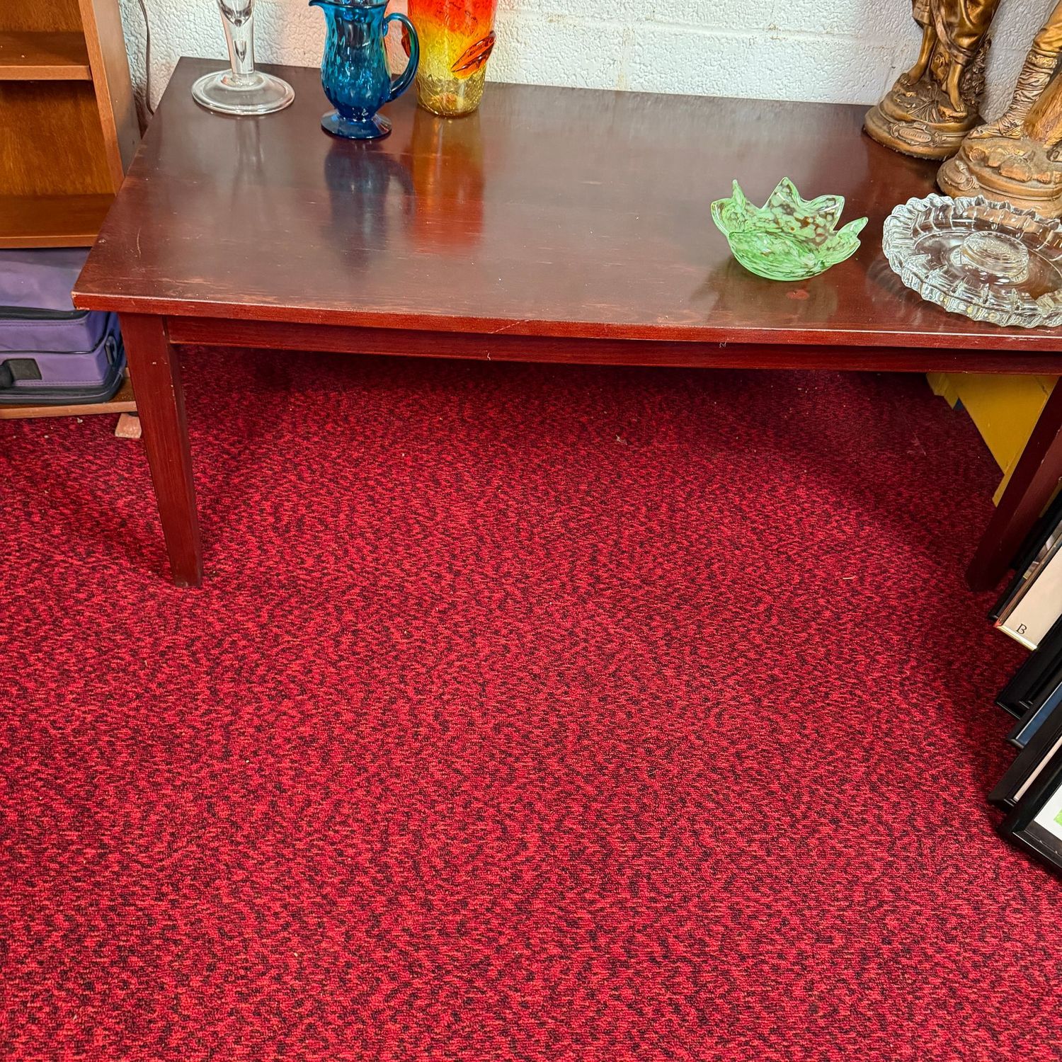 Cherry-colored coffee table, very sturdy, does show some wear and minor marks, 16"H x 44"L x 24"D (This item is in the lower level)