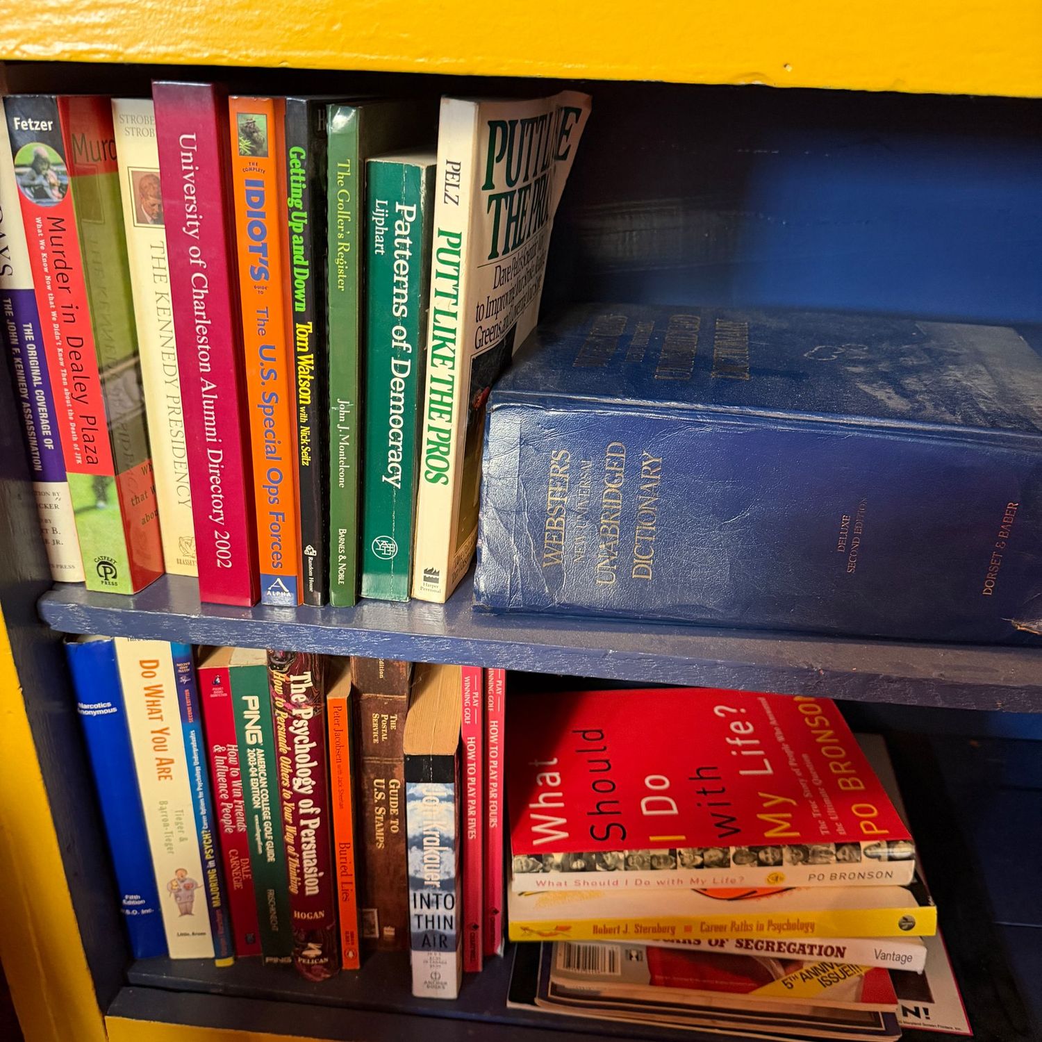 Group of books, mostly paperback, dictionary, murder in dealy plaza, into thin air, Kennedy presidency