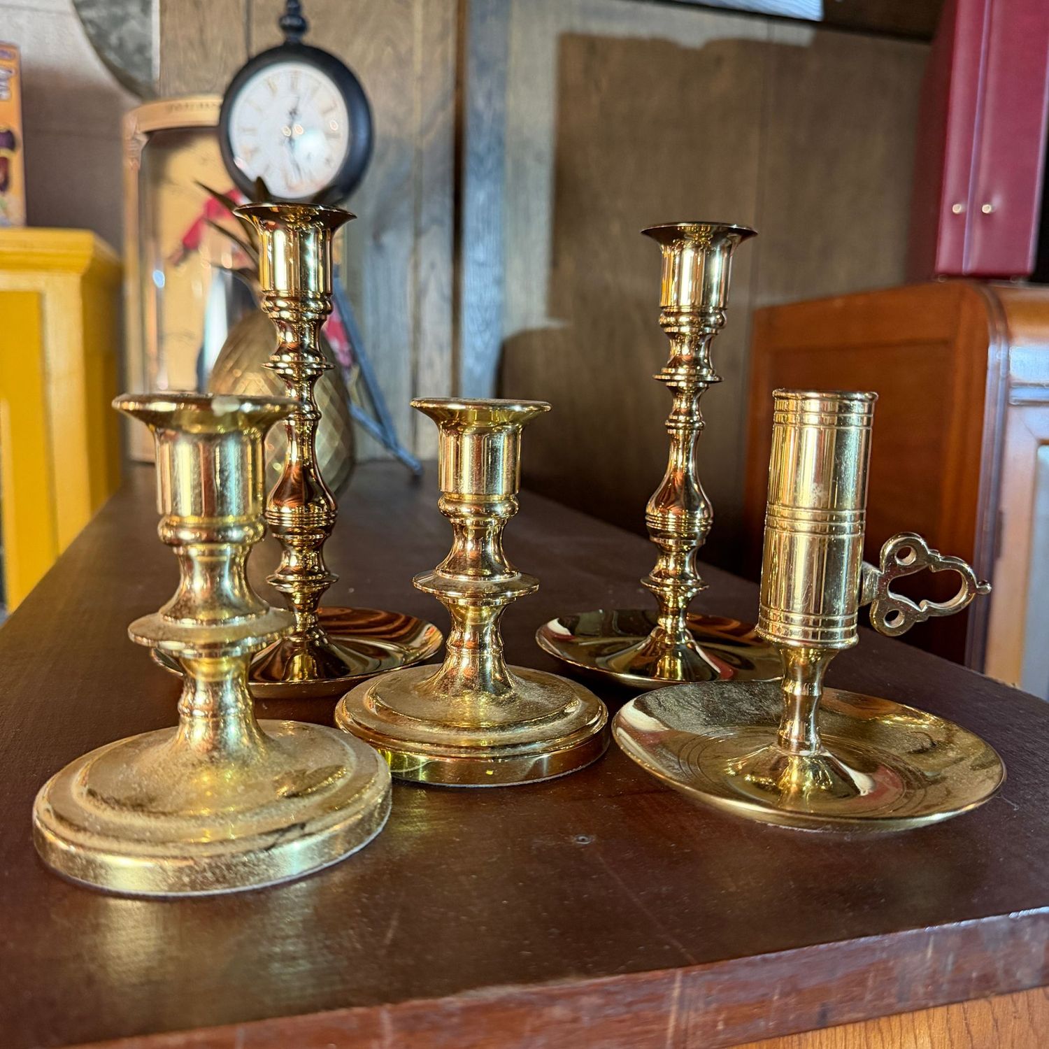 Group of 5 solid brass candlesticks, the tallest is 6"