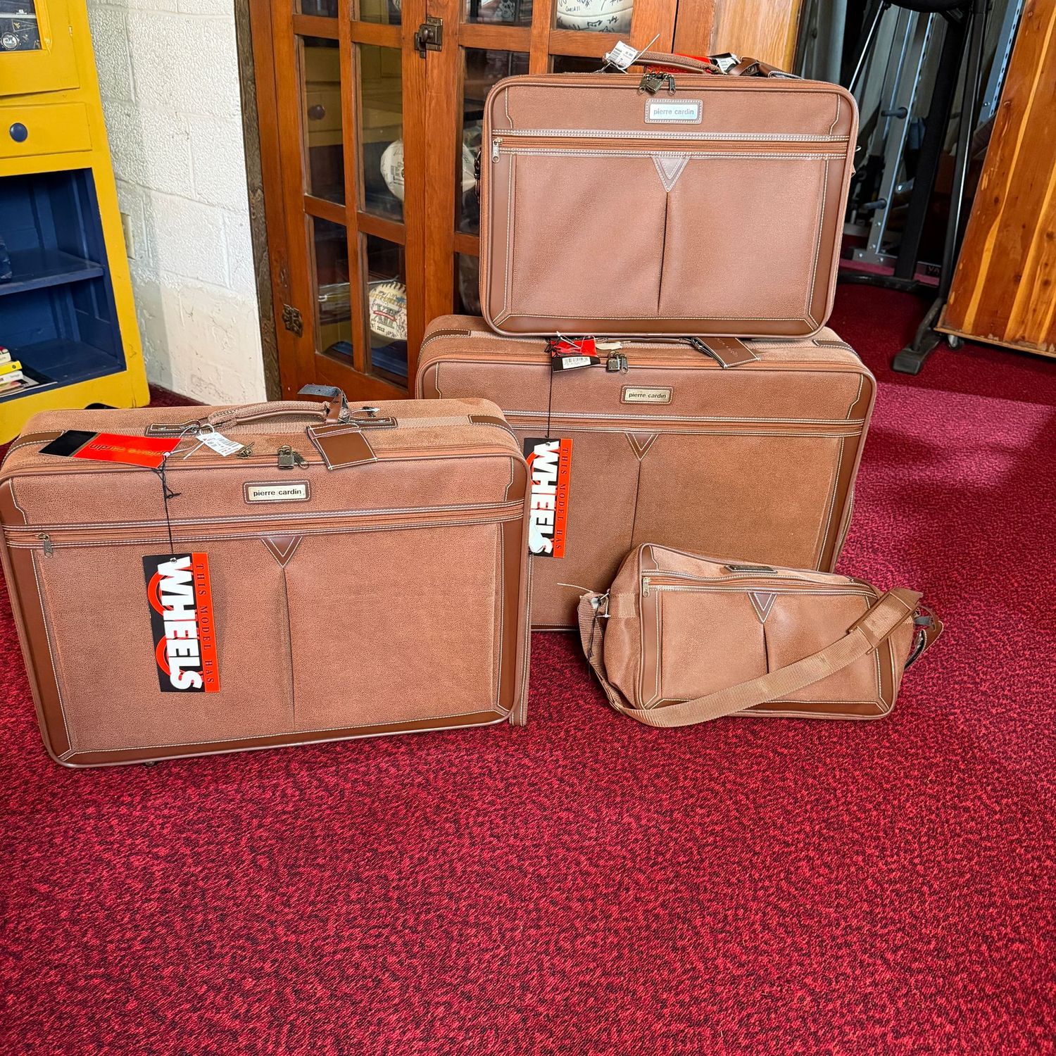 Set of Pierre Cardin suede suitcases, unused, very nice condition, two have wheels, the largest is 20" x 28"