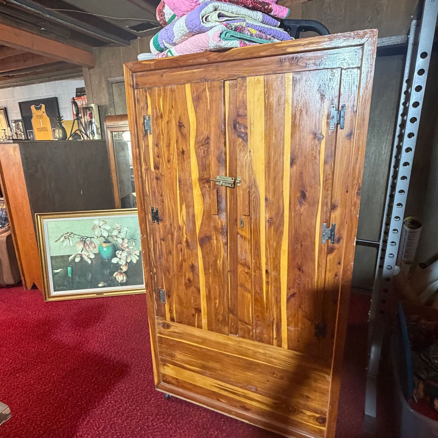 Cedar armoire, some wear to finish, some chips to finish, on casters, 66"H x 36"L x 22"D (This item is heavy and in the lower level)