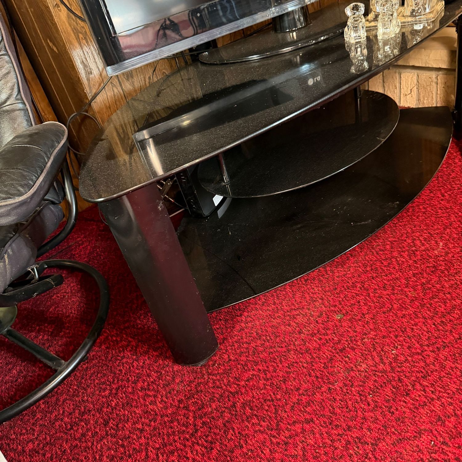 Glass and metal wedge-shaped TV stand with TV mount pole in back, 48"L x 26"D x 38"H (This item is heavy & in the lower level)